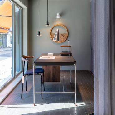 Modern workspace in Carl Hansen & Son's Pimlico store, featuring Scandinavian design elements, stylish lighting, and minimalist furniture.
