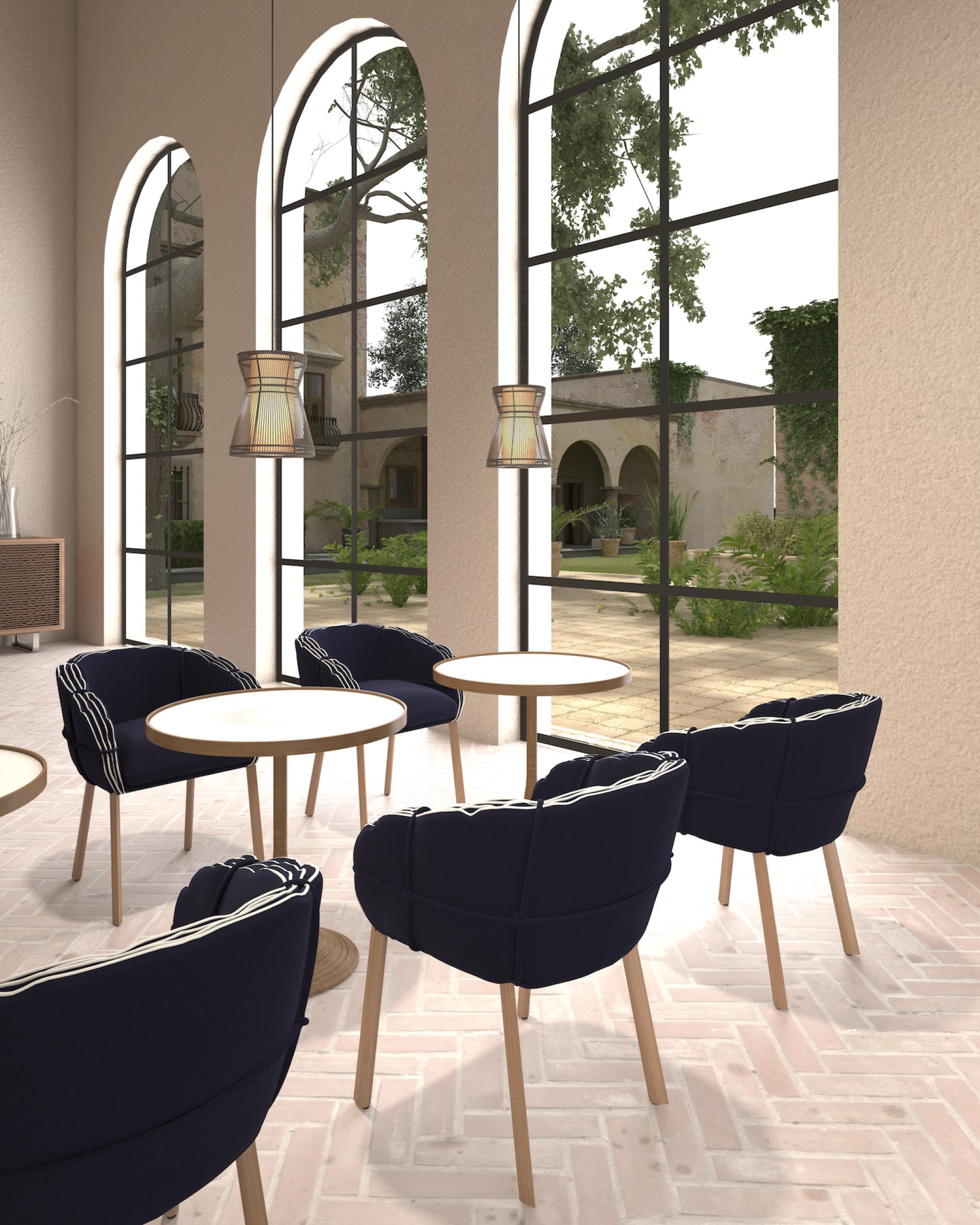 Luxurious Parchment seating collection by Kenneth Cobonpue, featuring elegant chairs and refined tables in a stylish interior.