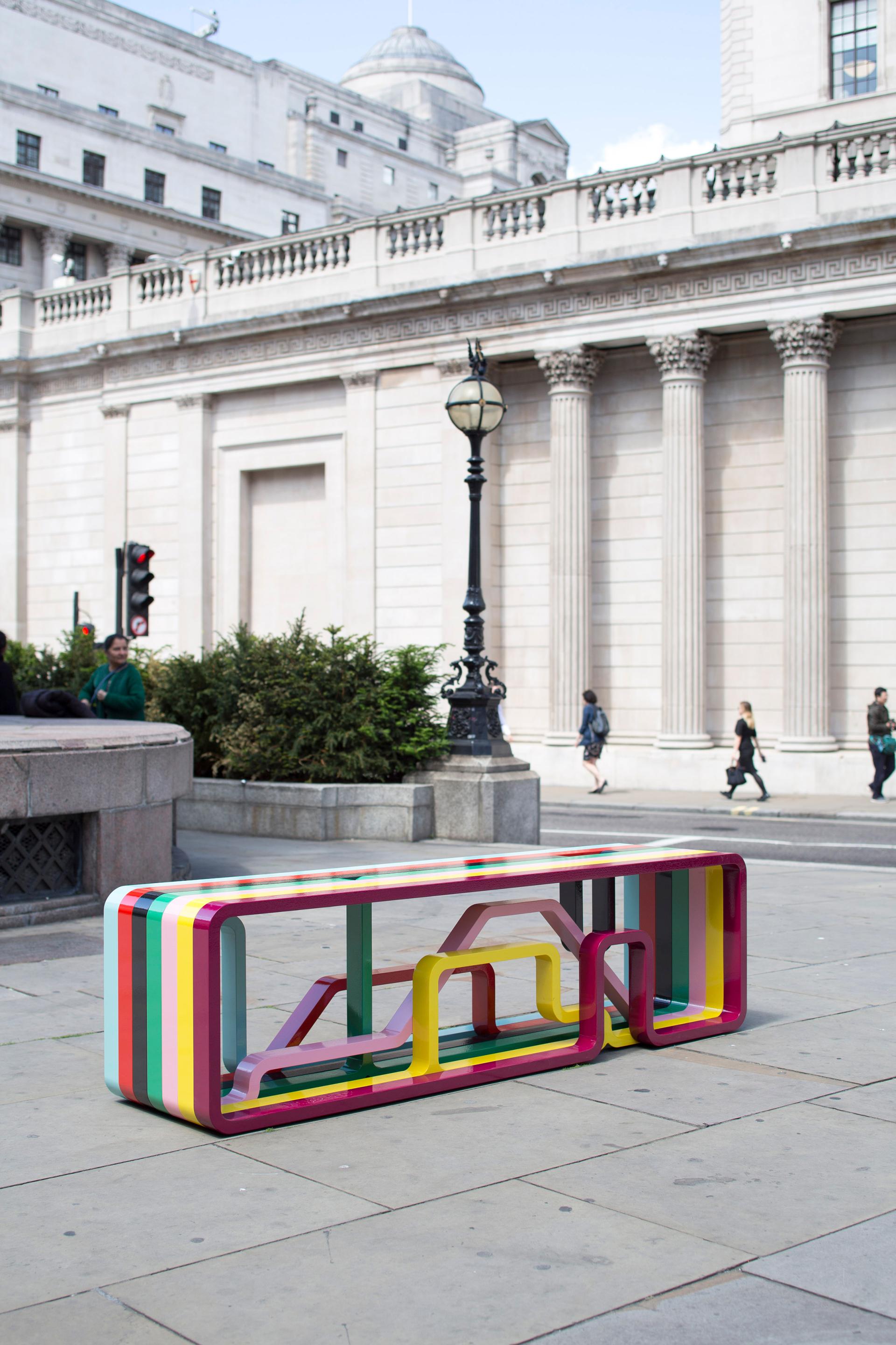Vibrant, contemporary bench design showcased in an urban setting, highlighting the intersection of craft and functionality.