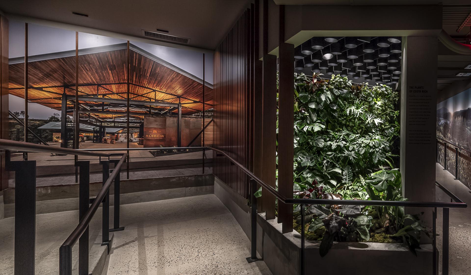 Luxurious interior of Starbucks Reserve Roastery featuring lush greenery and modern architectural design in the Meatpacking District.