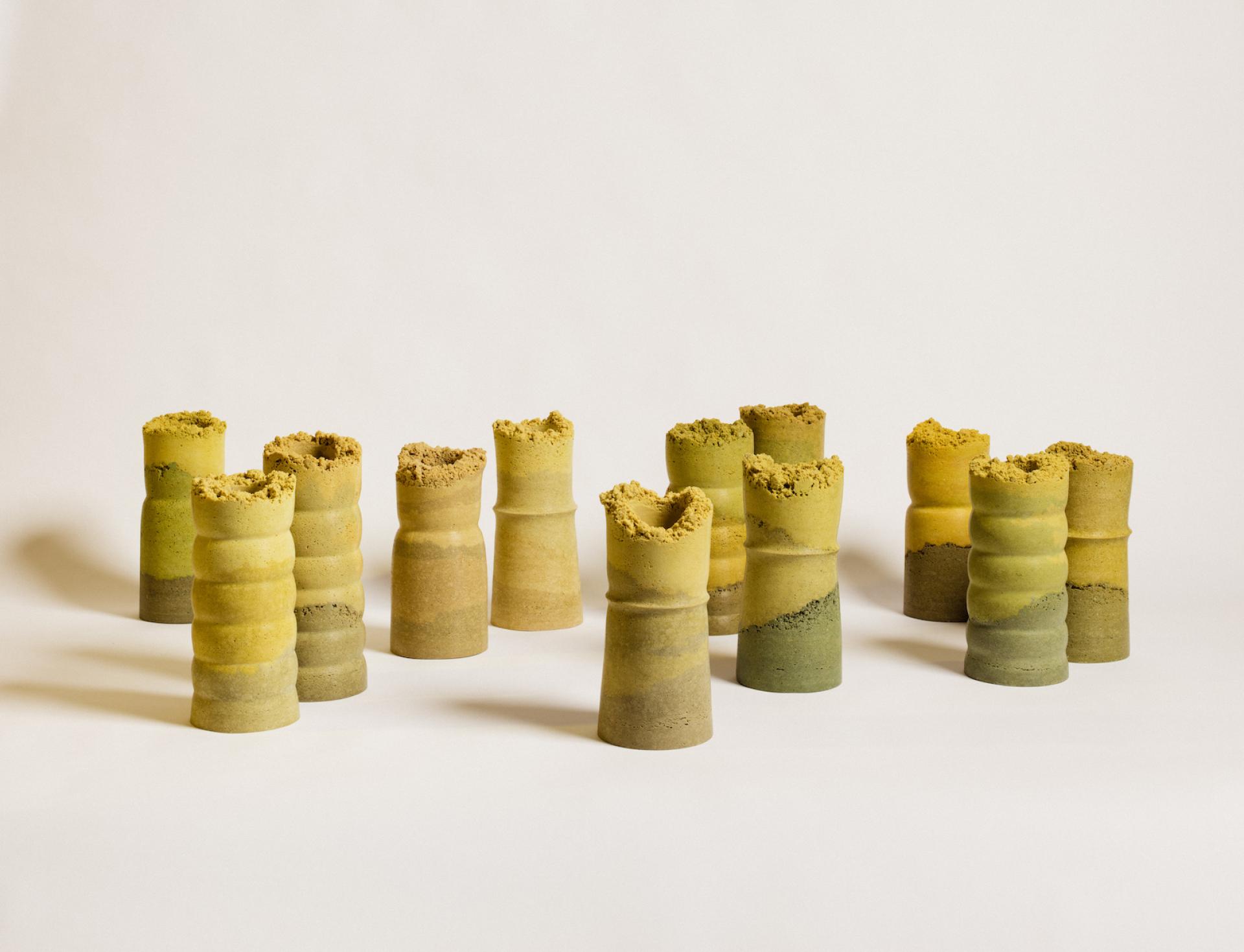 Handcrafted ceramic vessels in earthy tones, showcasing conscious design and natural materials, reflecting Monika Swindells' artistic vision.