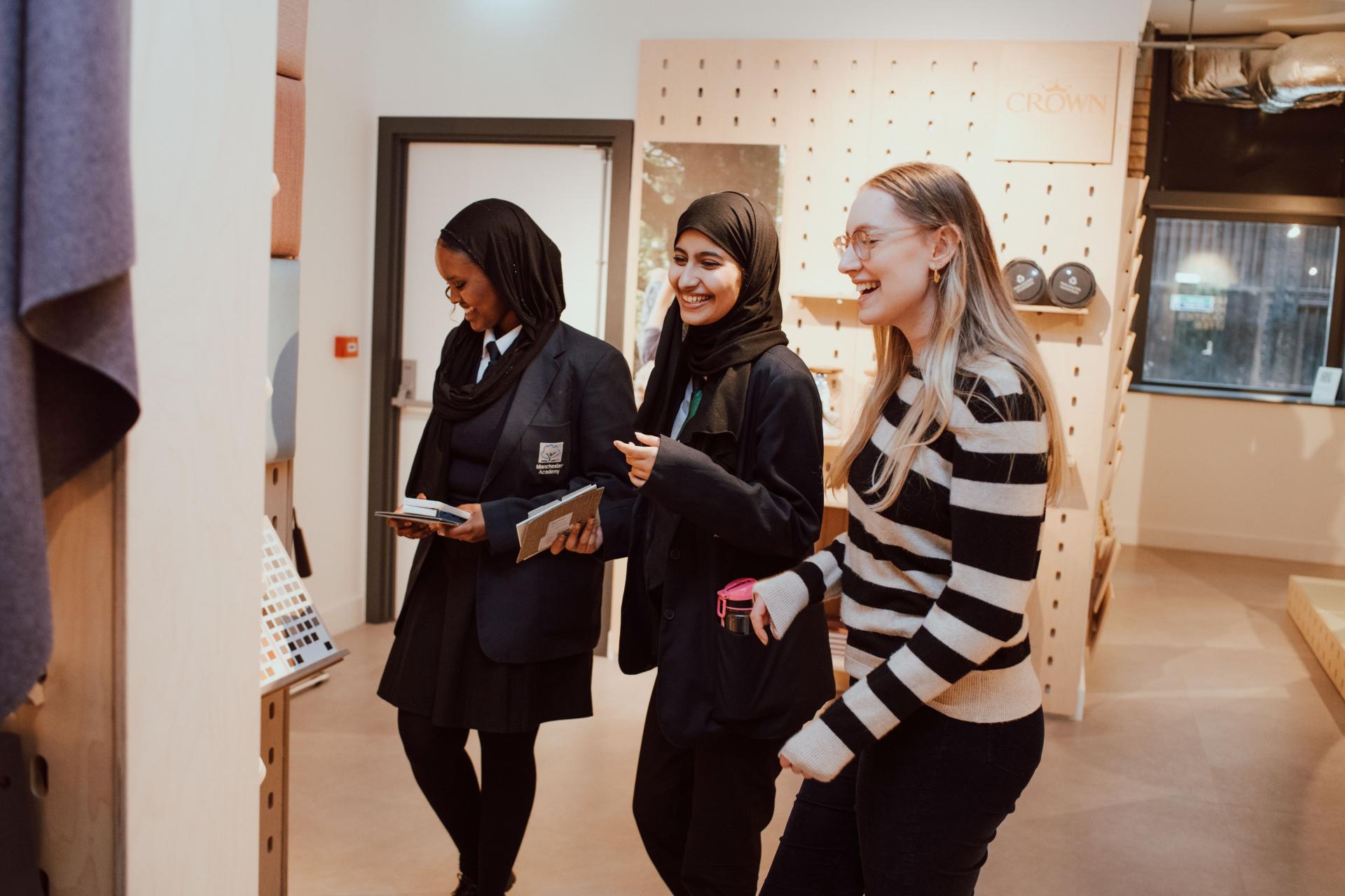 Students from Manchester Academy engage in creative discussions during an interior design collaboration with SCENE Interiors.