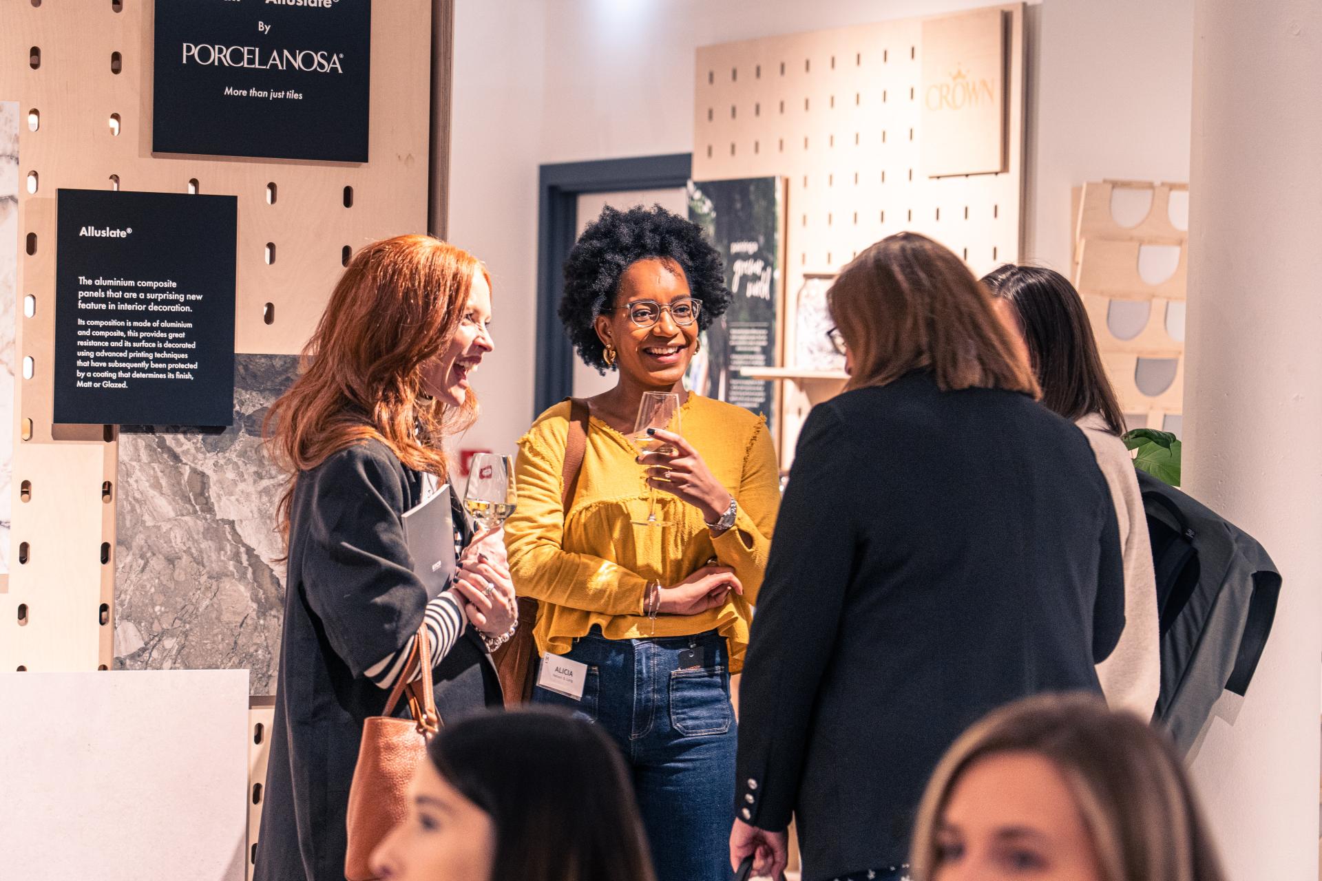 Professionals engage in conversation during a Material Source Studio event, featuring design and EDI discussions.