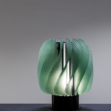 Elegant green glass lighting installation by Raw-Edges, showcased in WonderGlass' new London showroom during the design festival.
