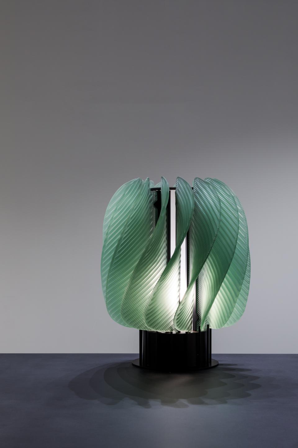 Elegant green glass lighting installation by Raw-Edges, showcased in WonderGlass' new London showroom during the design festival.