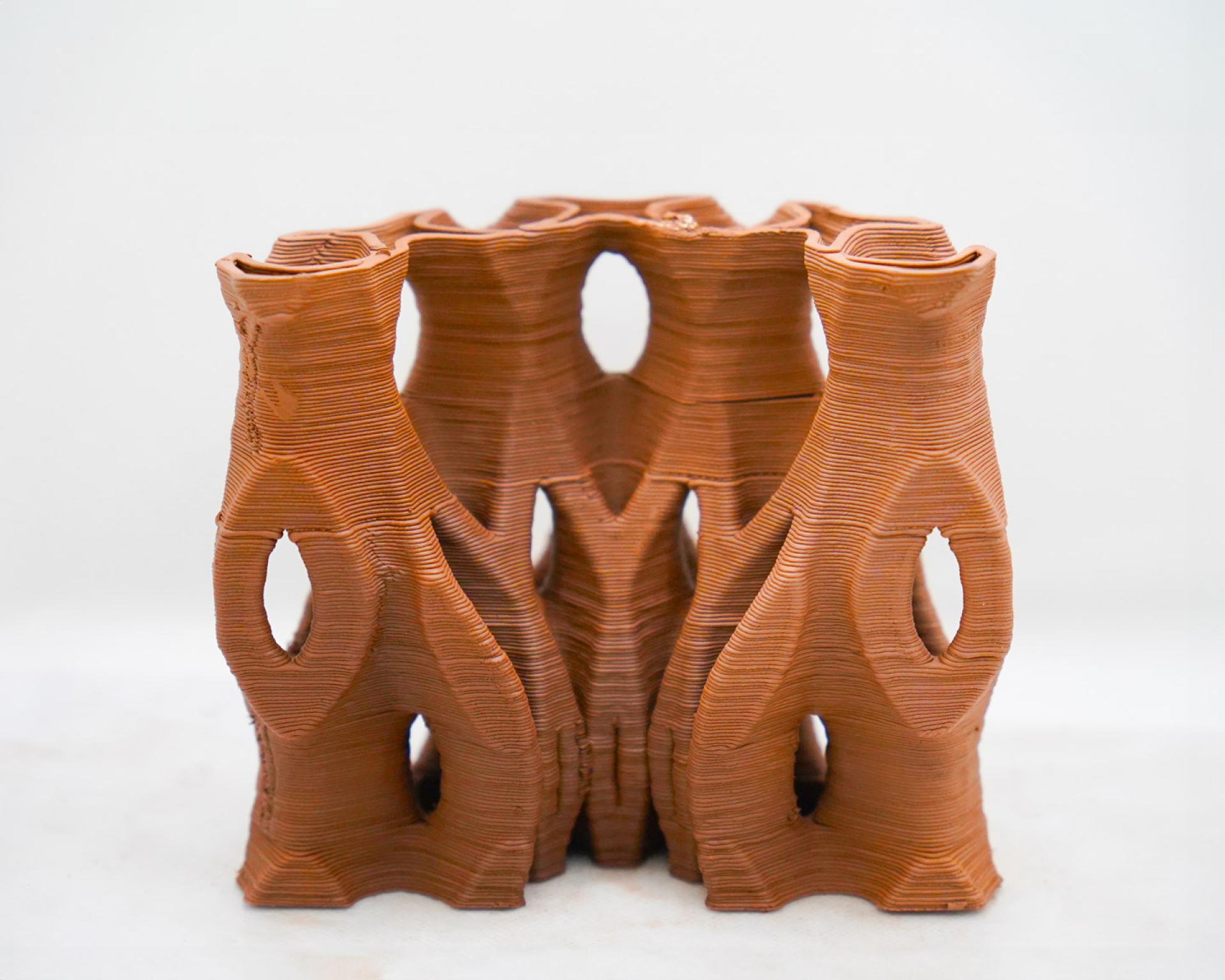3D-printed clay structure designed for building cooling efficiency, showcasing innovative architecture and sustainable design techniques.