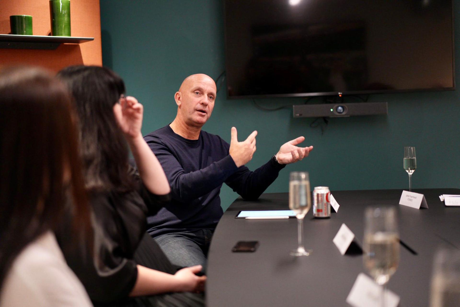 Discussion among professionals in a modern workplace setting, highlighting collaboration and communication in evolving work environments.