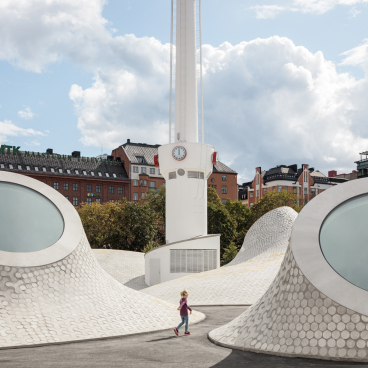 Helsinki's new art museum features unique architectural elements, with children exploring its innovative public spaces and design.