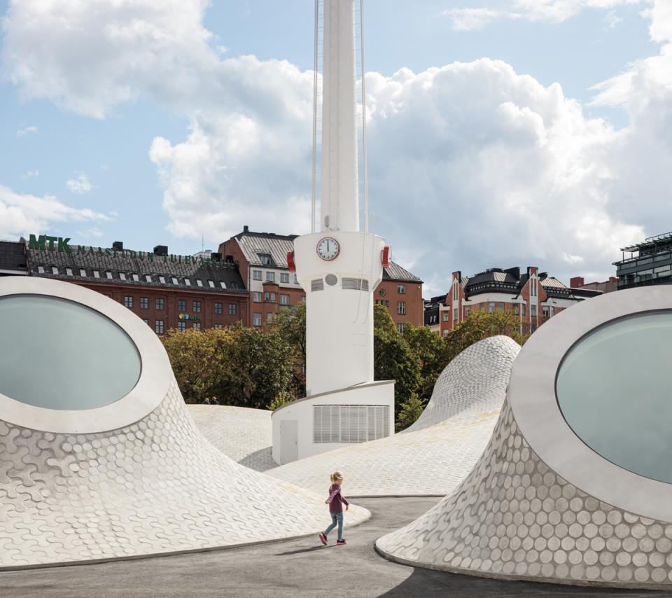 Helsinki's new art museum features unique architectural elements, with children exploring its innovative public spaces and design.