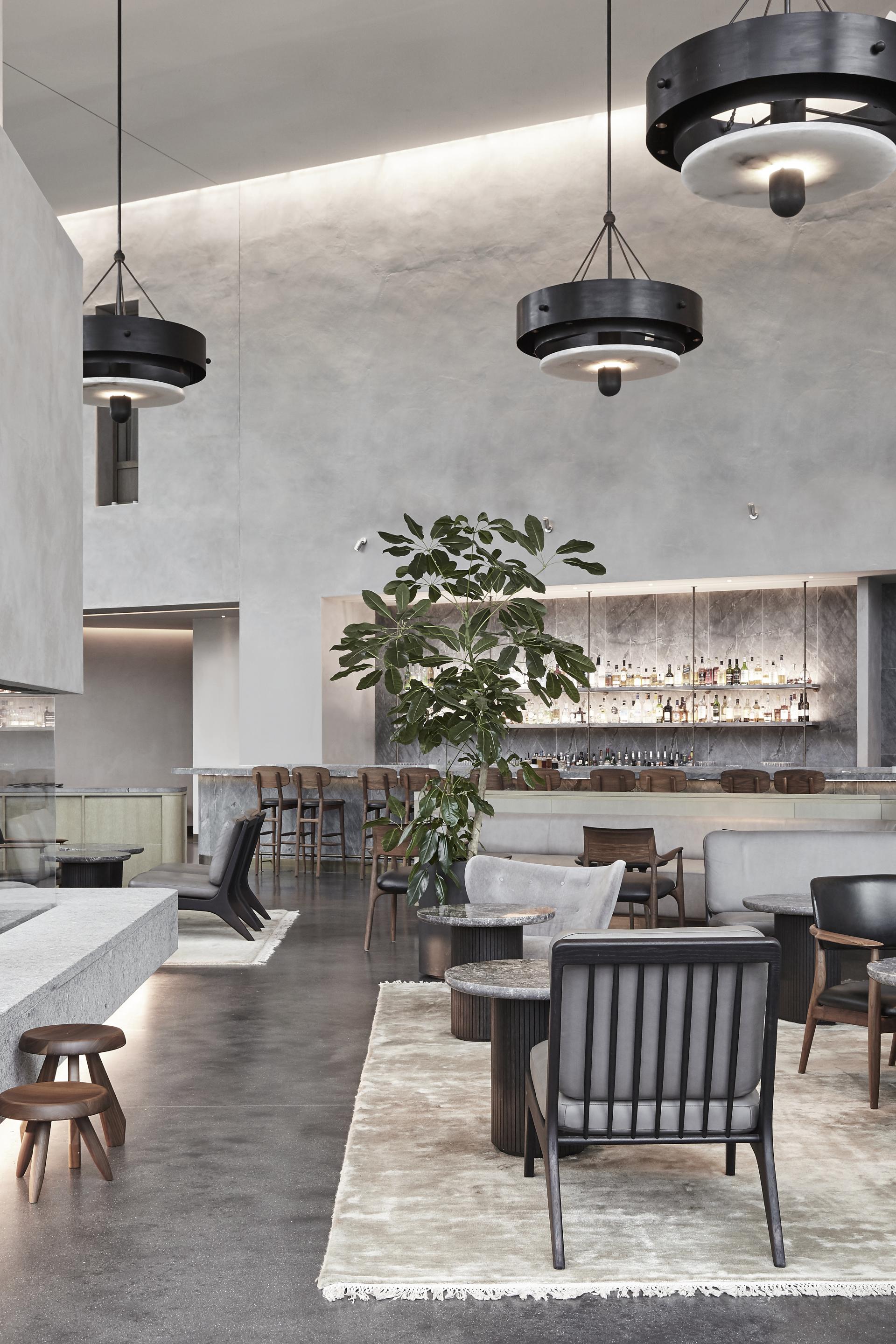 Sophisticated interior of The Stratford, featuring modern furniture, elegant lighting, and a vibrant plant, showcasing world-class design.