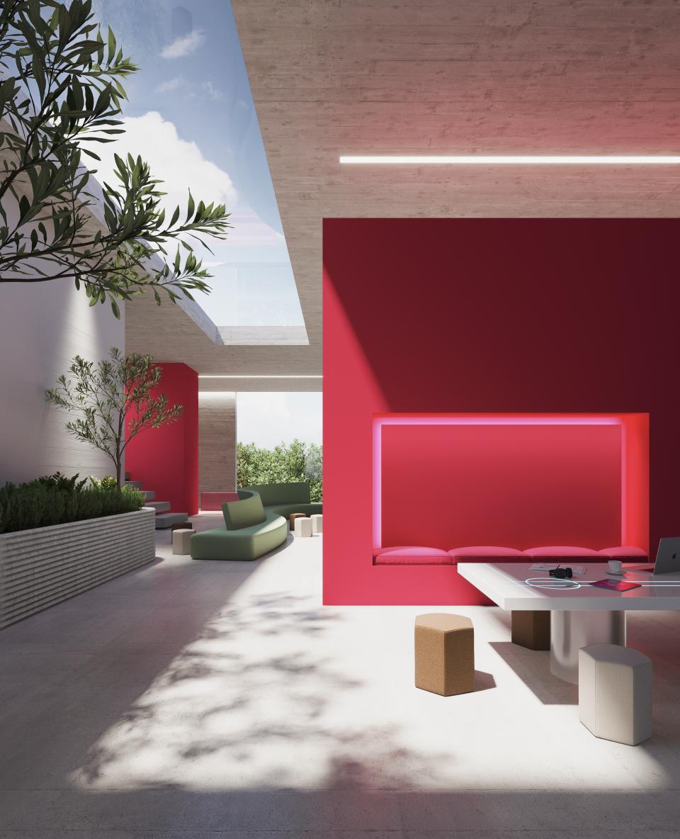Brightly colored interior showcasing a modern design, featuring a striking pink wall and stylish furniture inspired by the Awakening Palette.