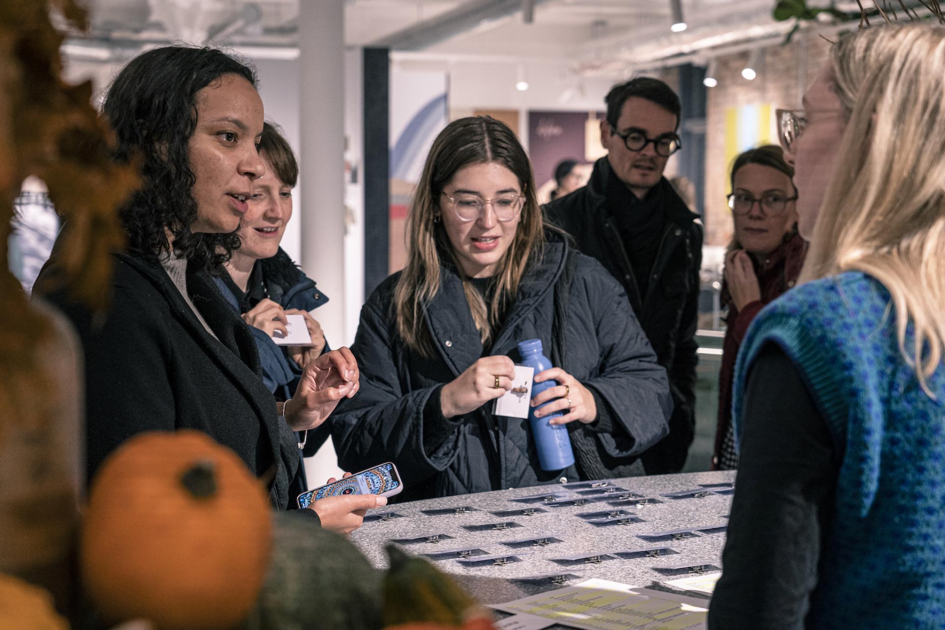 Participants engage in interactive activities focused on neurodiversity during the Material Source Studio seminar, exploring design strategies.