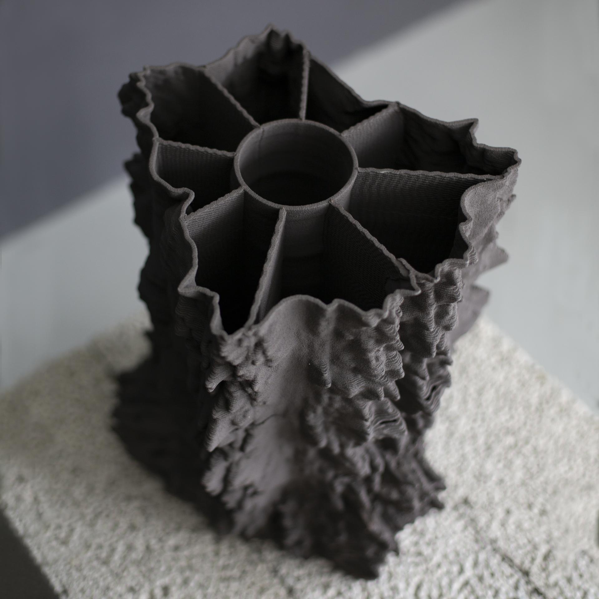 3D printed abstract vase design with textured surface, showcasing innovative construction techniques for modern architecture.