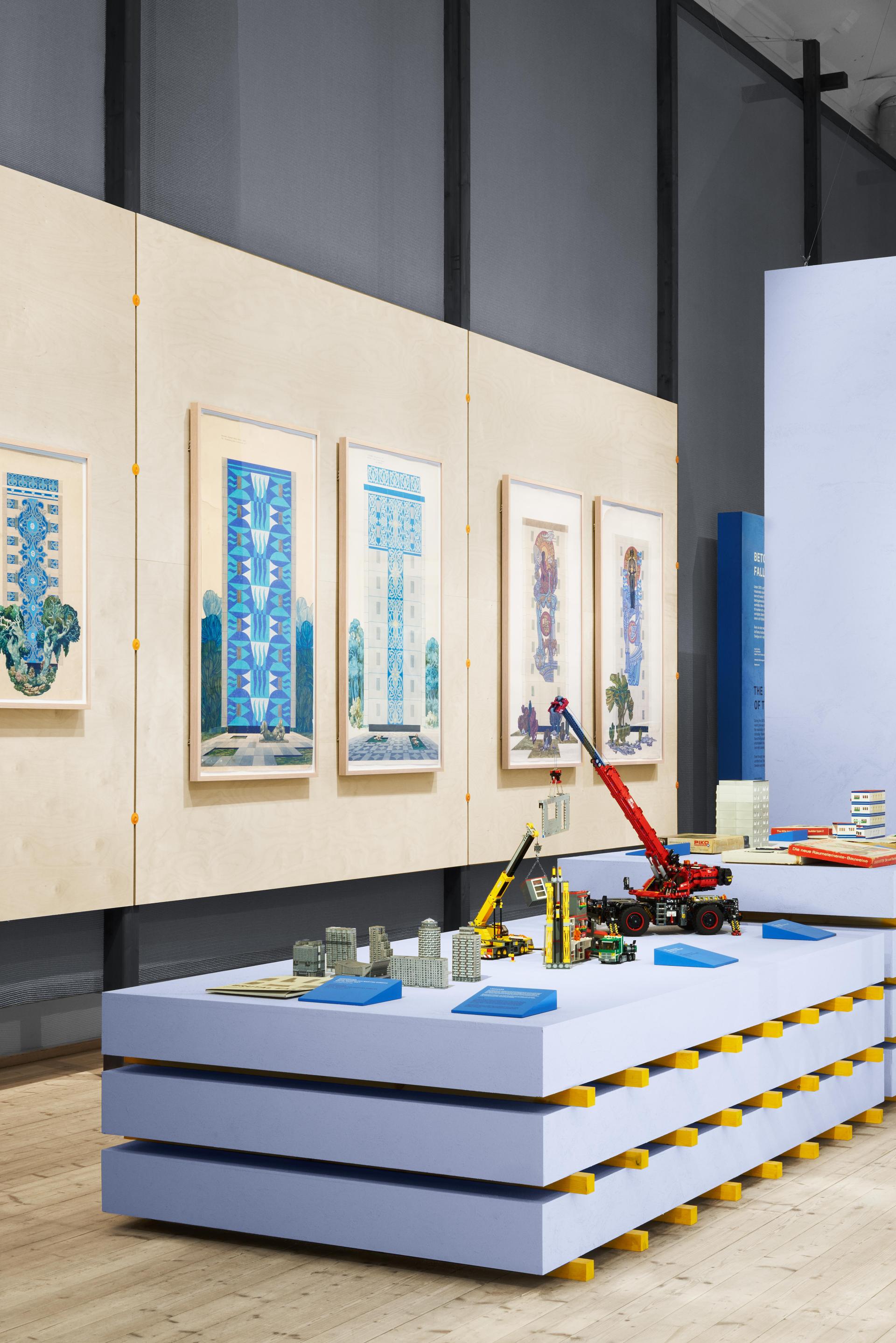 Exhibits showcasing architectural designs and models representing concrete's role in urban reconstruction at ArkDes, Stockholm.