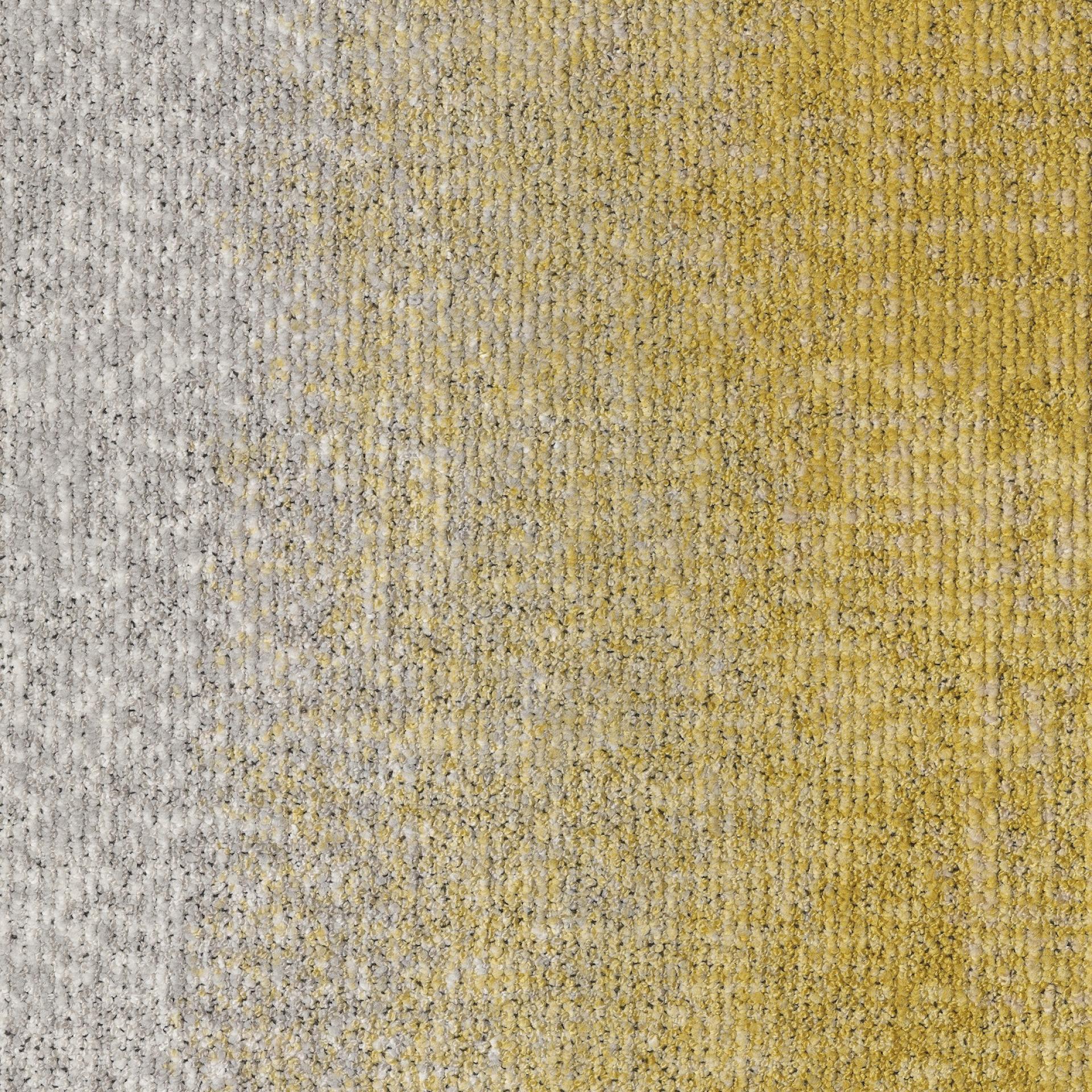 Textured carpet featuring a gradient of gray and yellow colors, inspired by the architecture of nature in Ege's ReForm Transition collection.
