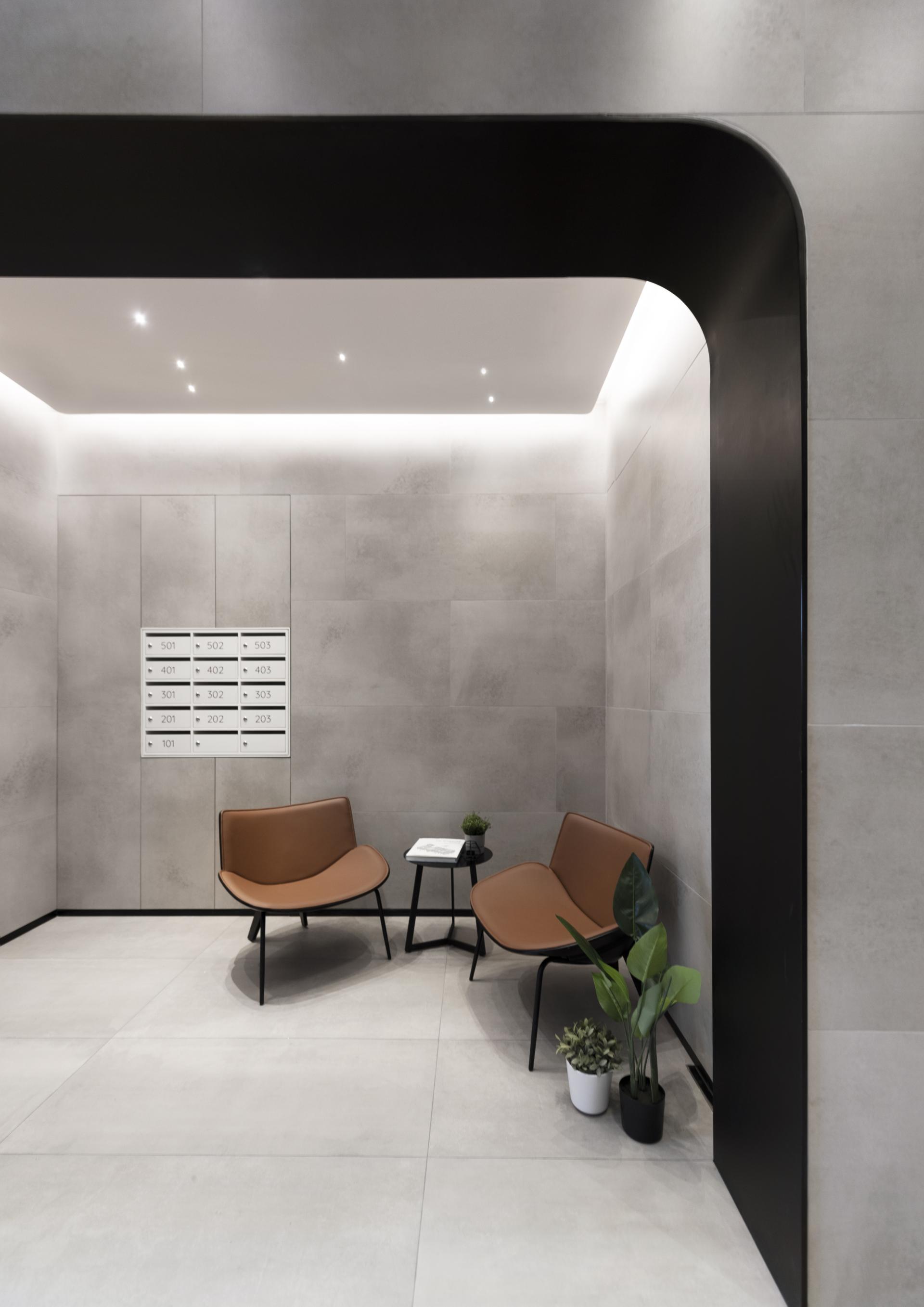 Contemporary Live+Work space featuring modern seating and minimalistic design elements, promoting a productive work-from-home environment.