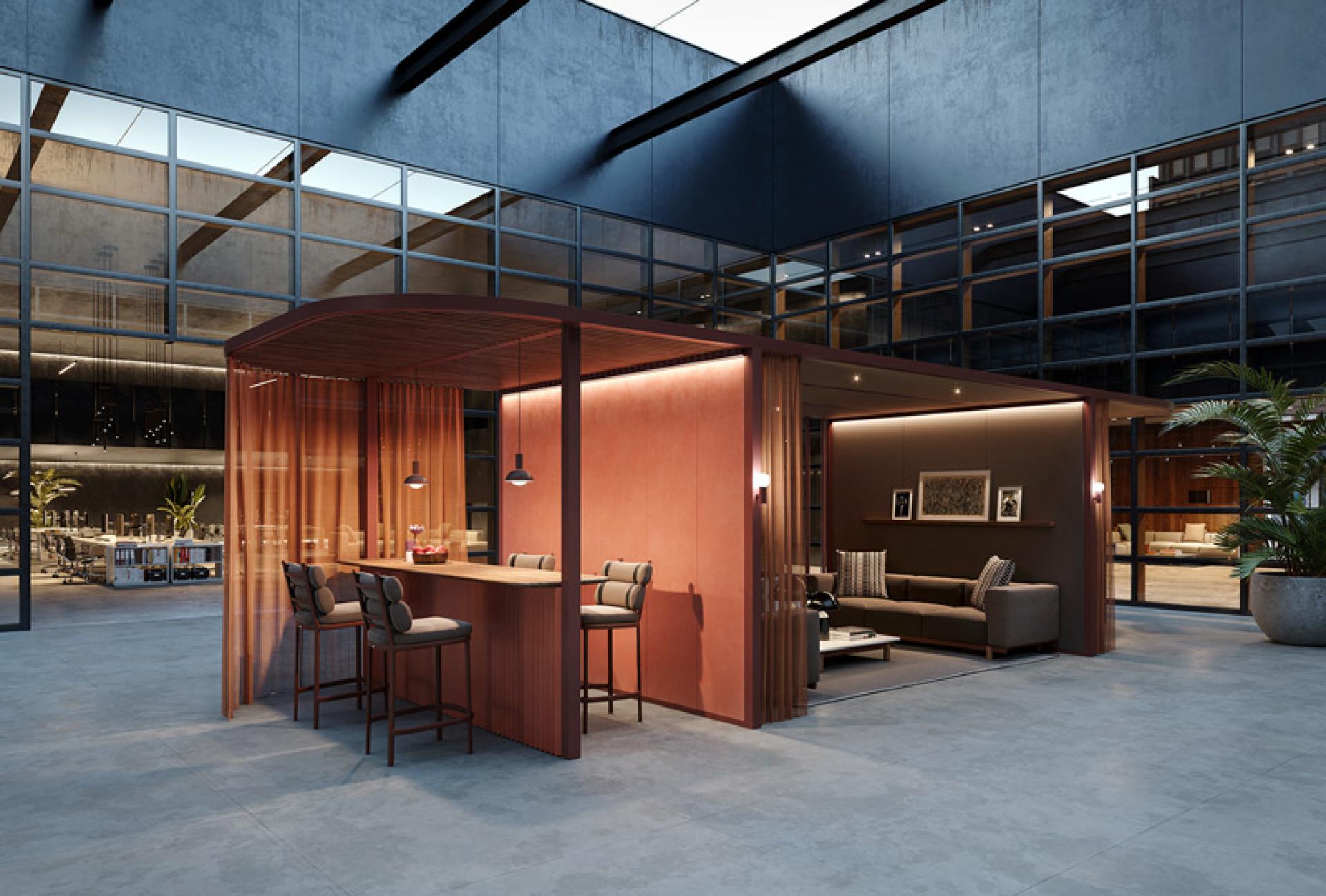 Modern workspace design featuring an inviting lounge area with a bar and cozy seating, emphasizing innovative office design principles.