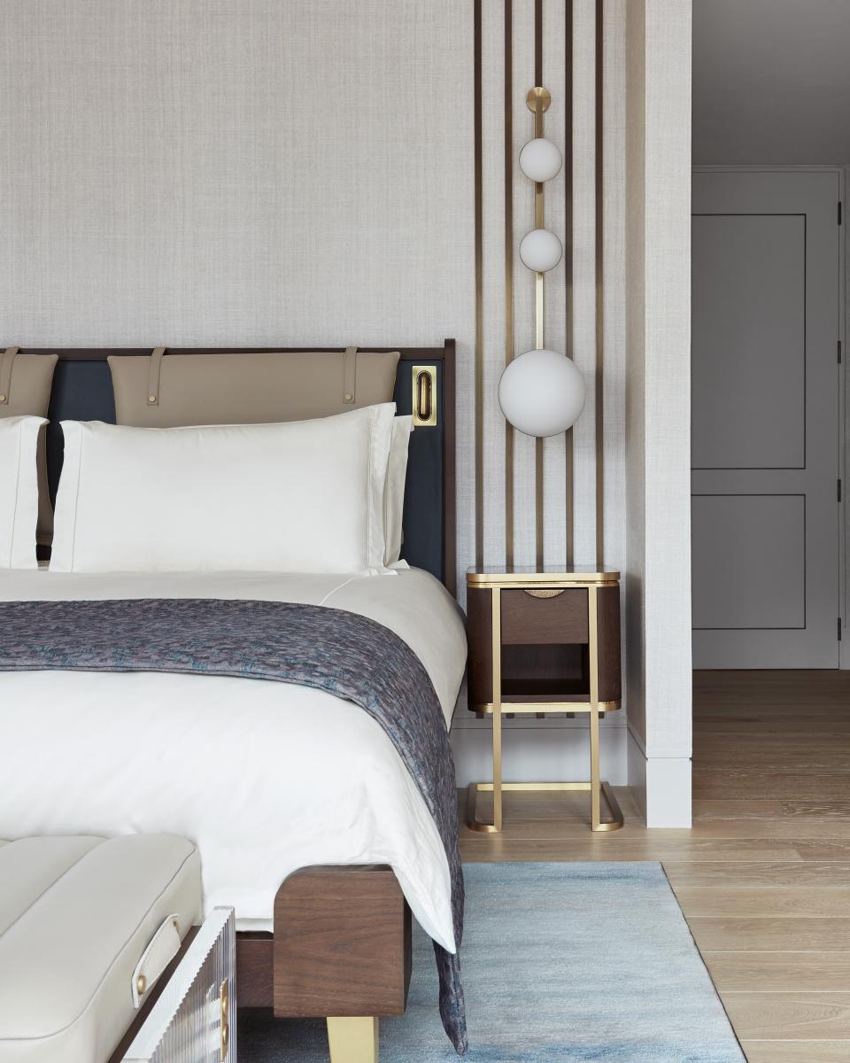 Elegant penthouse bedroom at Mandarin Oriental London, featuring a luxurious bed, stylish lighting, and modern furnishings by Joyce Wang Studio.