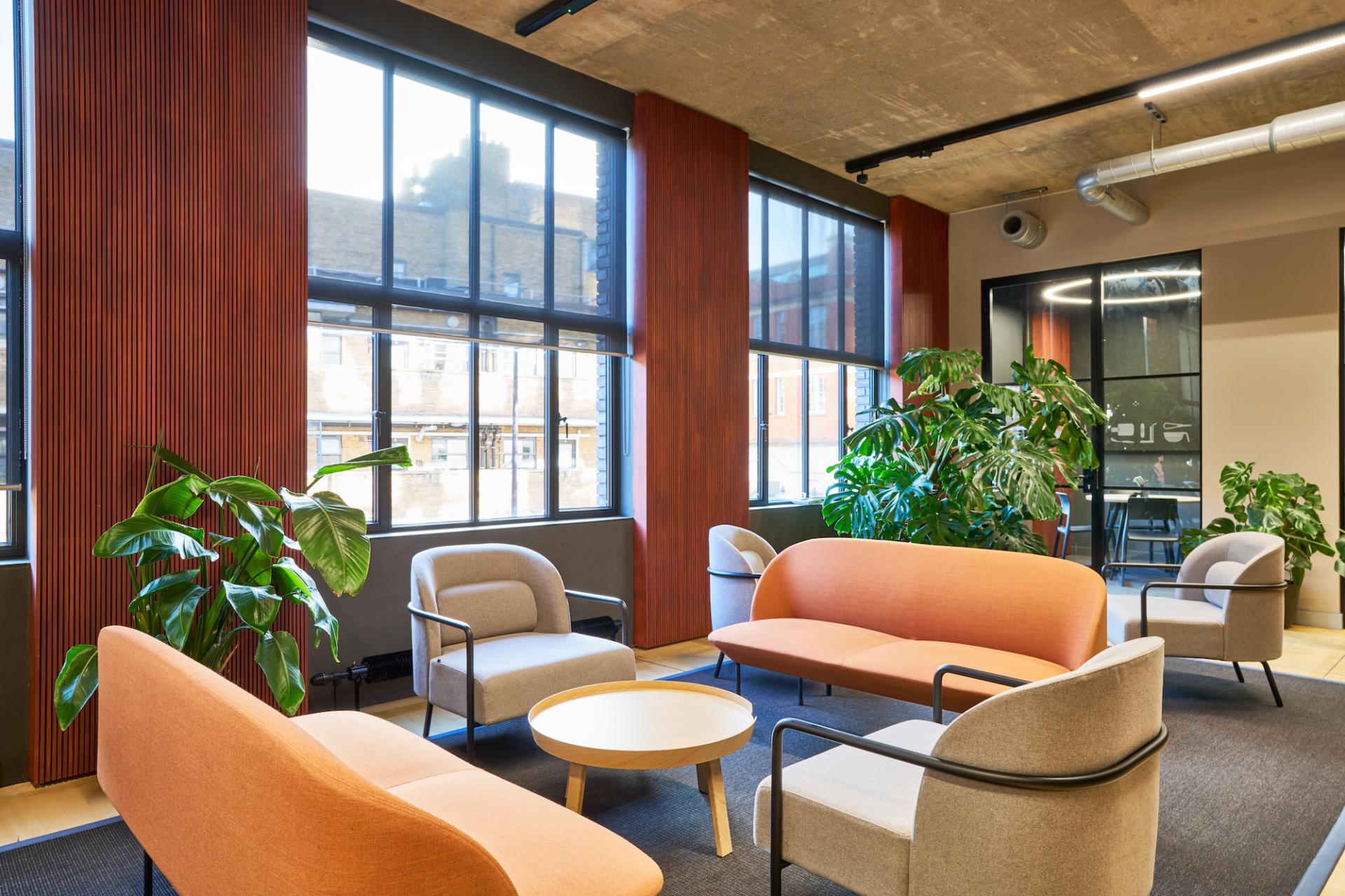 Chic London workspace featuring modern seating, natural light, and greenery for Joseph Joseph's sustainable office design.