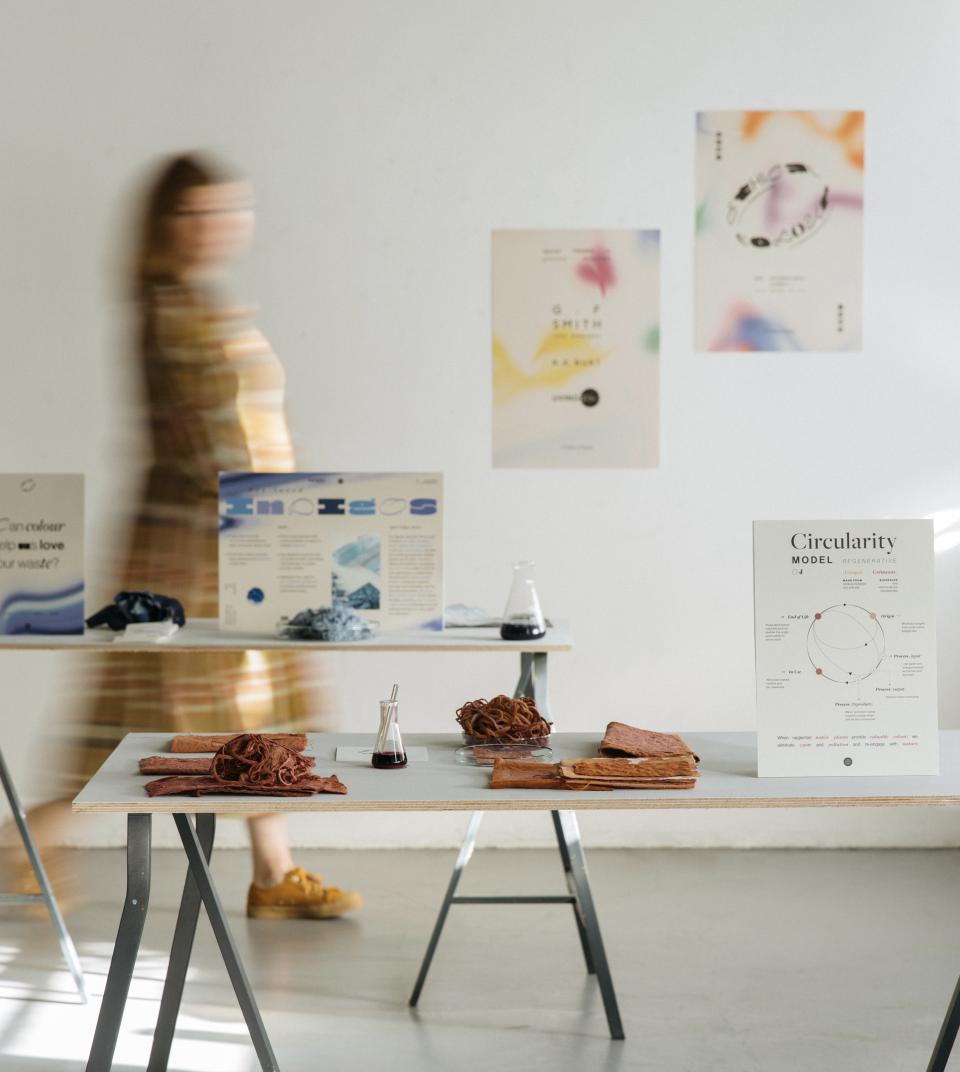 Exhibits showcasing sustainable materials and color concepts in circular design, featured in a bright, collaborative space.