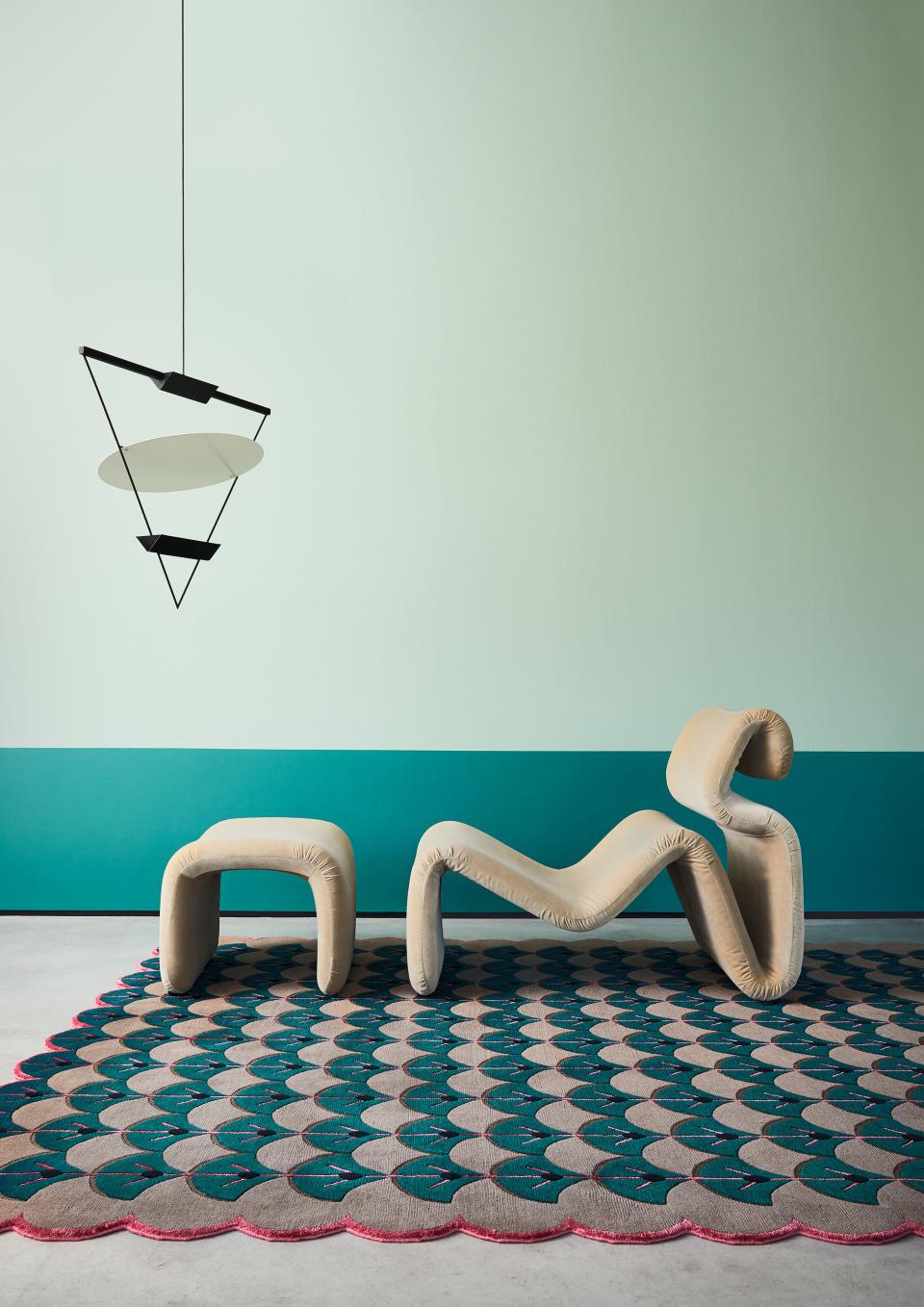 Whimsical furniture and a patterned rug create a playful design scene reflecting Indonesian and Colombian influences.