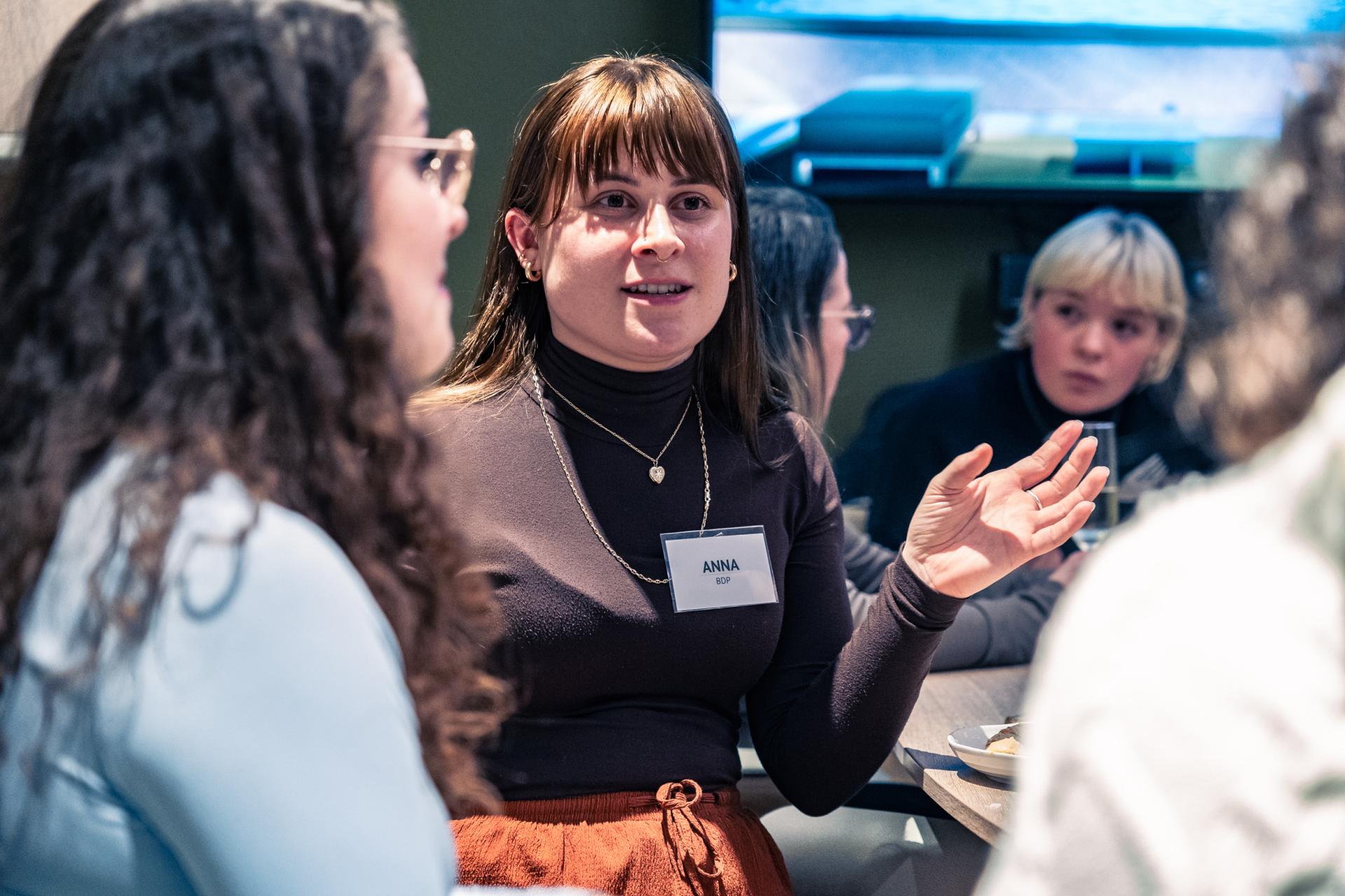 Participants engage in a discussion about achieving Net Zero, emphasizing the importance of materiality in climate action.