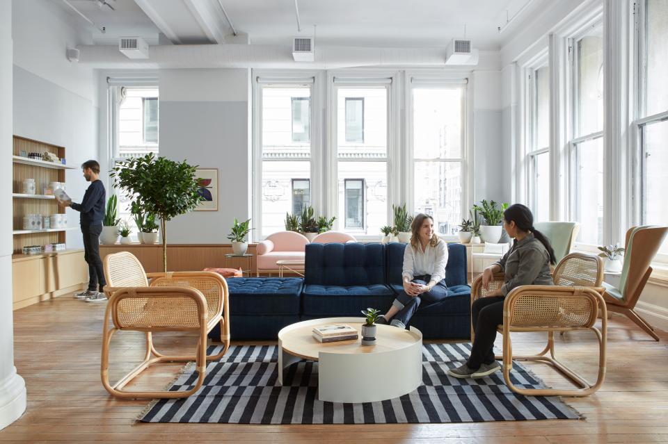 Modern medical practice waiting area designed by Alda Ly Architecture, featuring natural elements and comfortable seating arrangements.