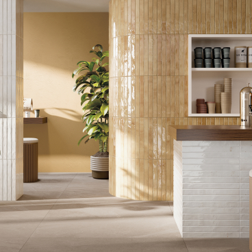 Stylish interior featuring Grestec's Mastreta elongated tiles, vibrant plants, and a contemporary counter design.