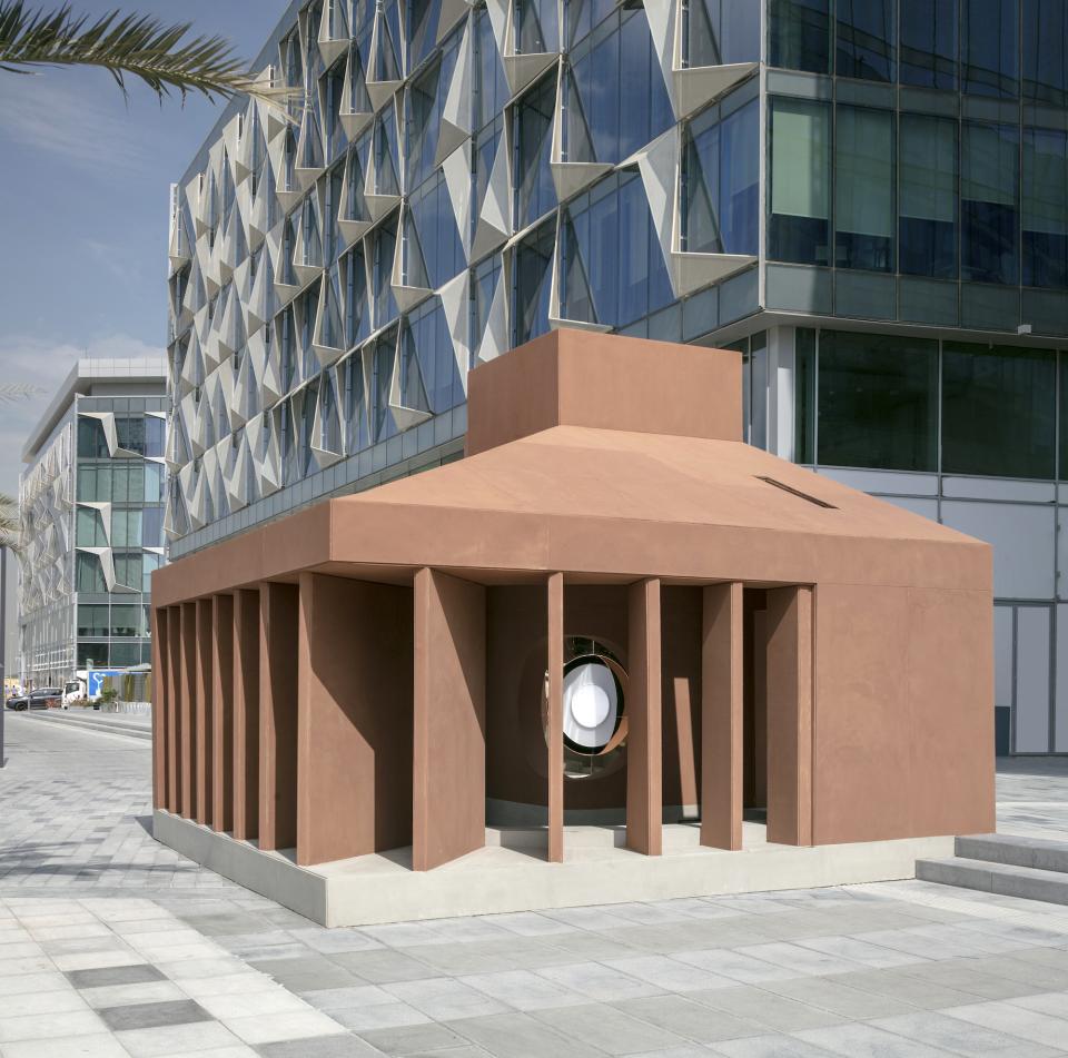 Anarchitect's installation at Dubai Design Week showcasing a sculptural structure with a circular opening emphasizing natural light.
