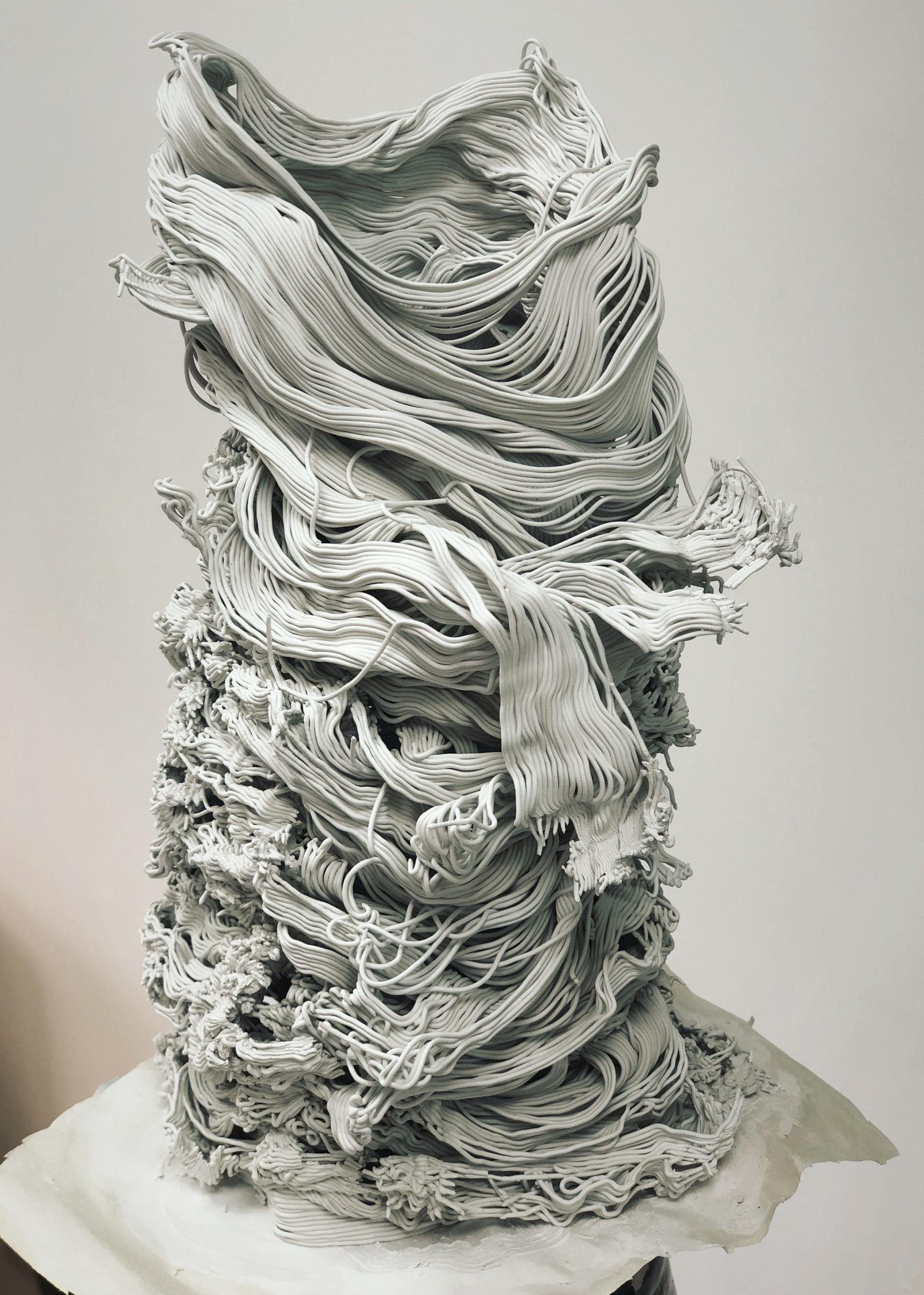 Abstract ceramic sculpture by Ryan Barrett showcasing intricate, flowing clay textures that embody innovative artistic expression.
