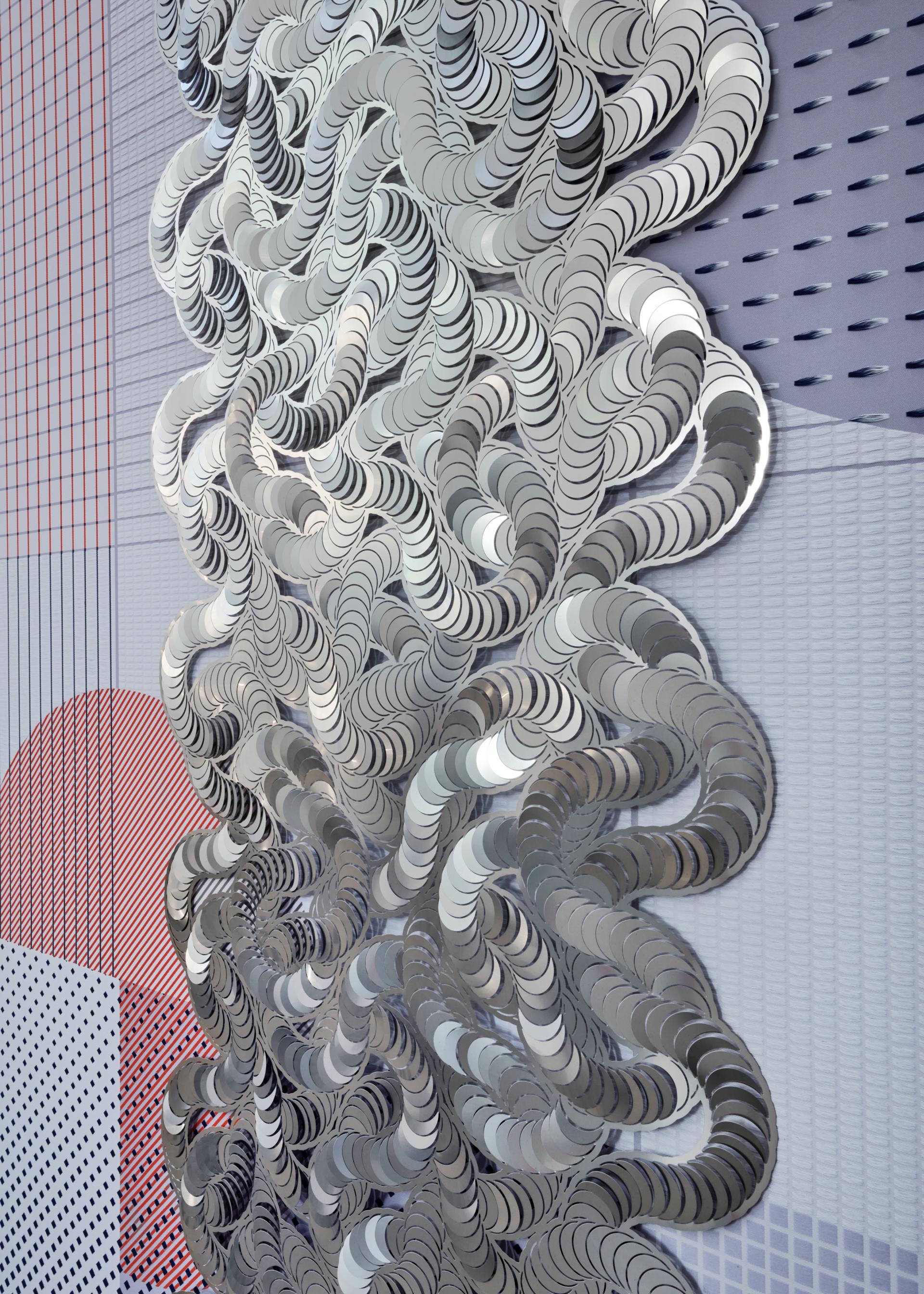 Abstract metallic installation art representing biotechnological design concepts against a patterned background, promoting sensory experience in restorative spaces.