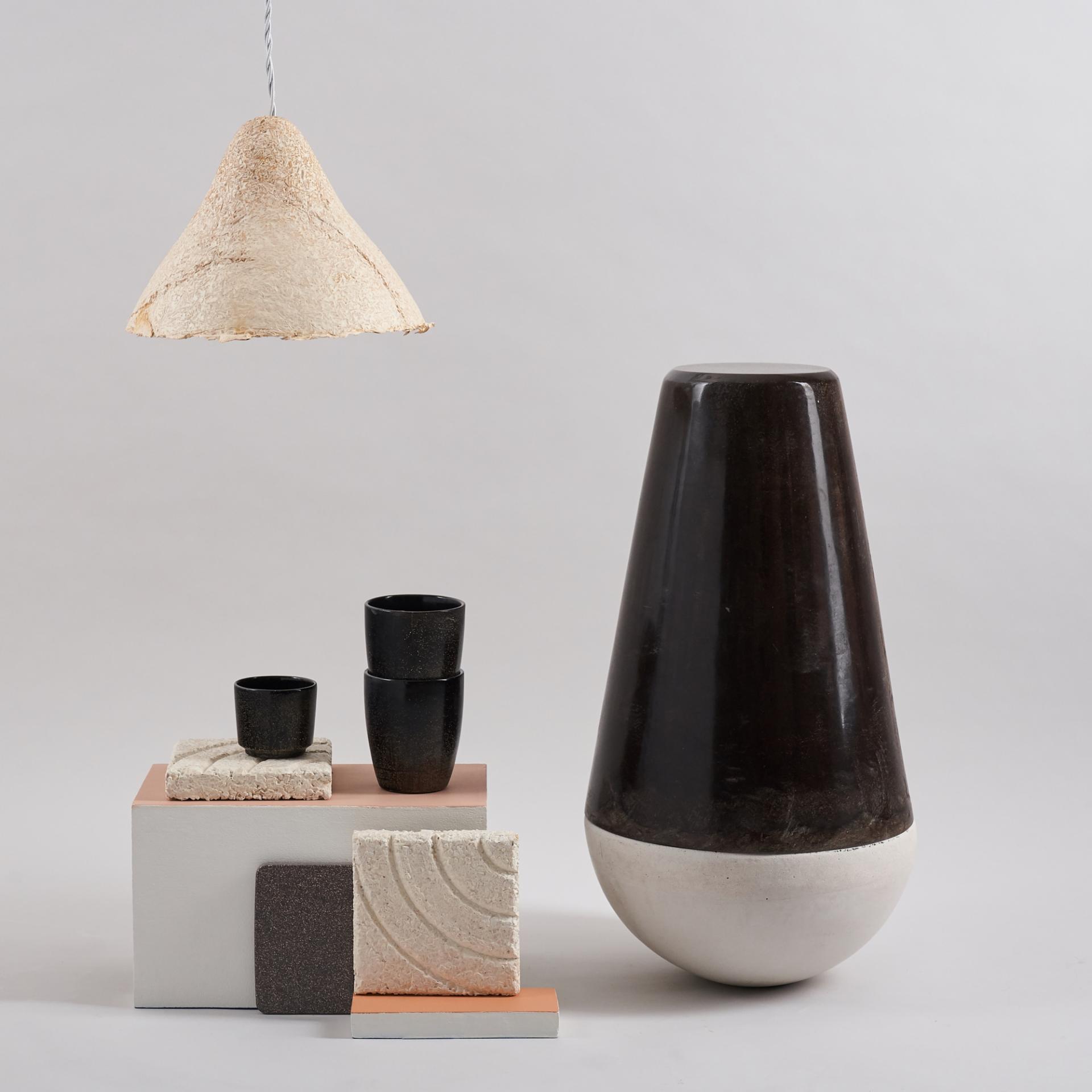 Modern design showcase featuring a sculptural vase, textured materials, and a unique pendant light for new creative minds.