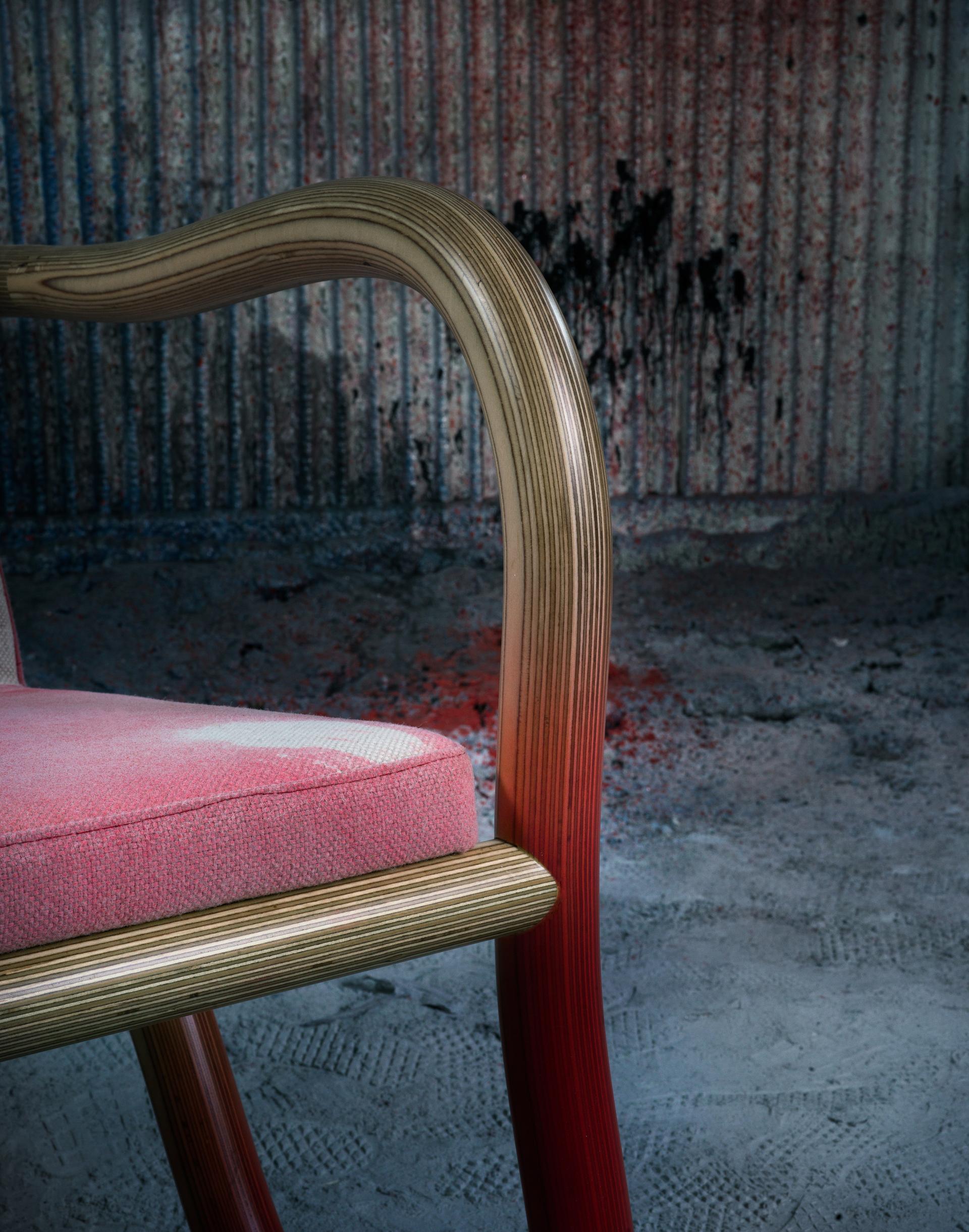 Bespoke Kolho chair featuring a pink upholstered seat and unique wooden armrests, designed by Matthew Day Jackson for Made by Choice.