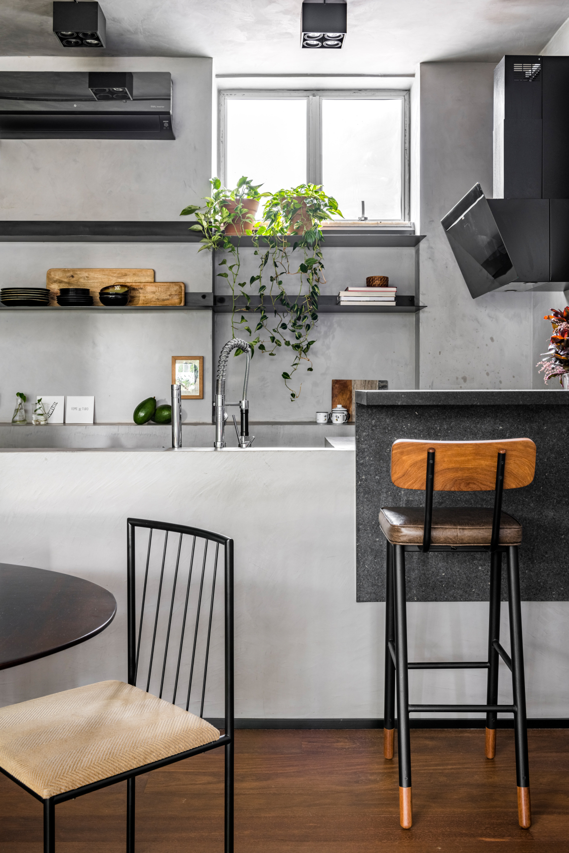 Modern kitchen interior with plants, minimalist decor, and functional design highlighting the harmony with nature.