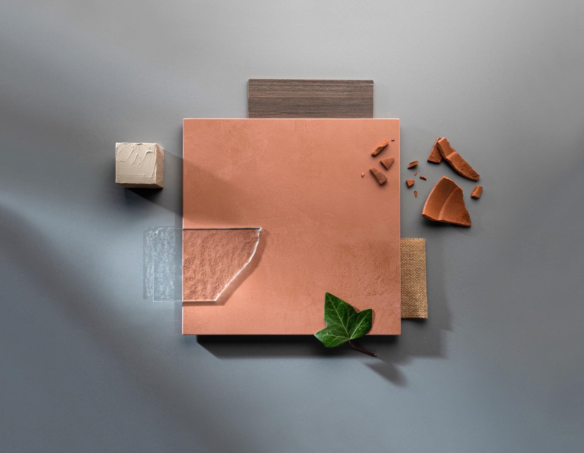 New Dekton® Onirika and Kraftizen samples displayed with natural materials, showcasing innovative surface design for modern interiors.