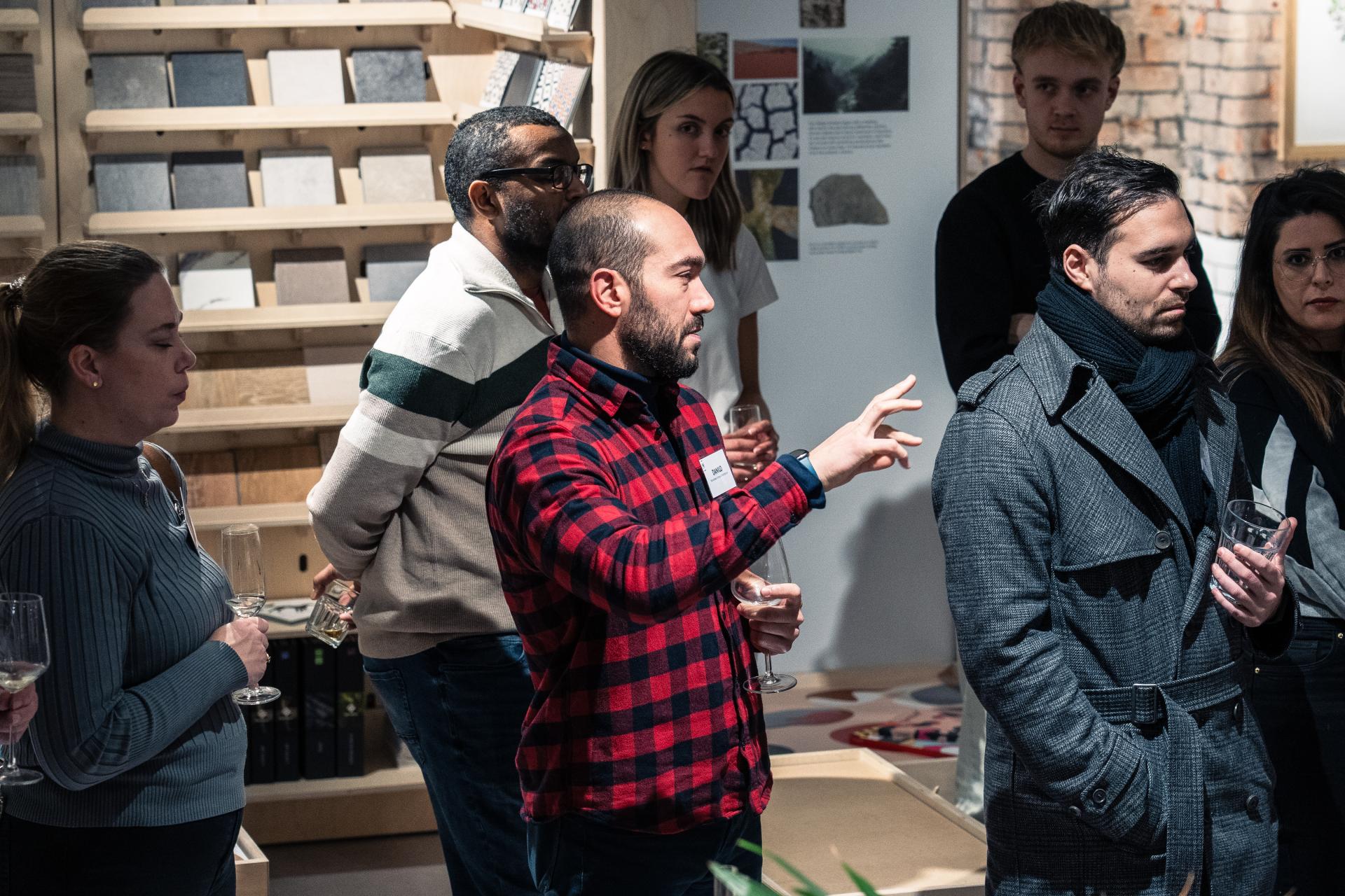 Participants engage in discussion about sustainable 3D printing and concrete solutions during a Full Circle Concrete exhibition event.