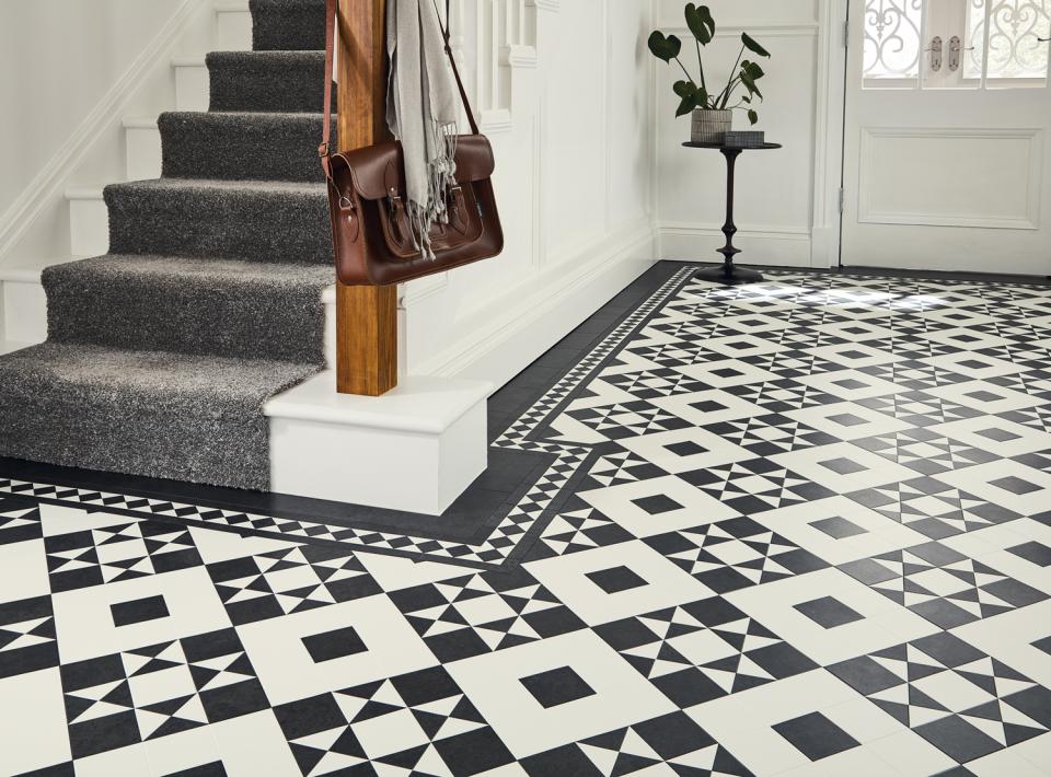 Heritage-inspired black and white tiles showcase a sophisticated Victorian design in a stylish entryway.