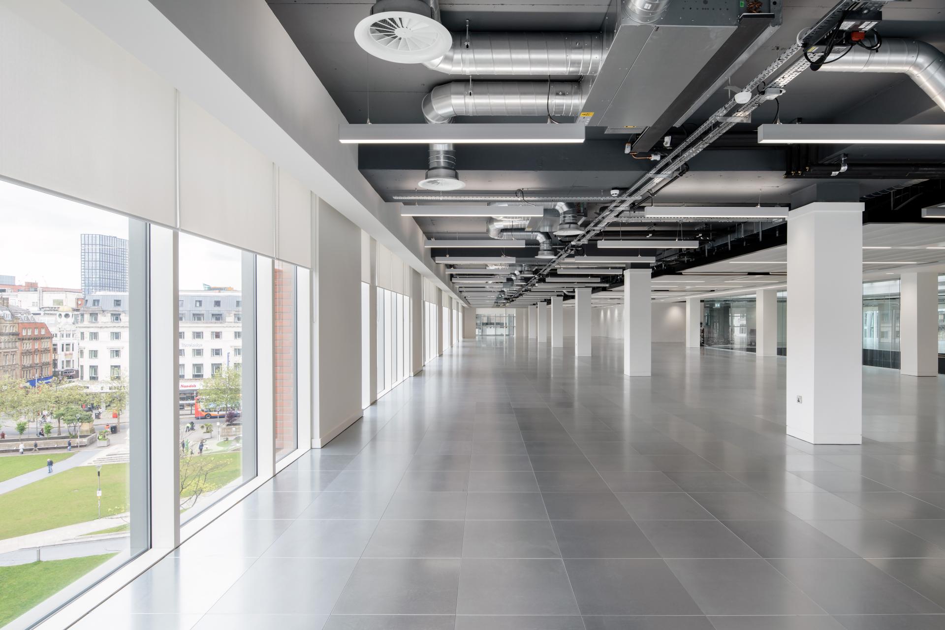 Modern office space in Manchester’s One Piccadilly Gardens, showcasing sleek design and natural light through expansive windows.