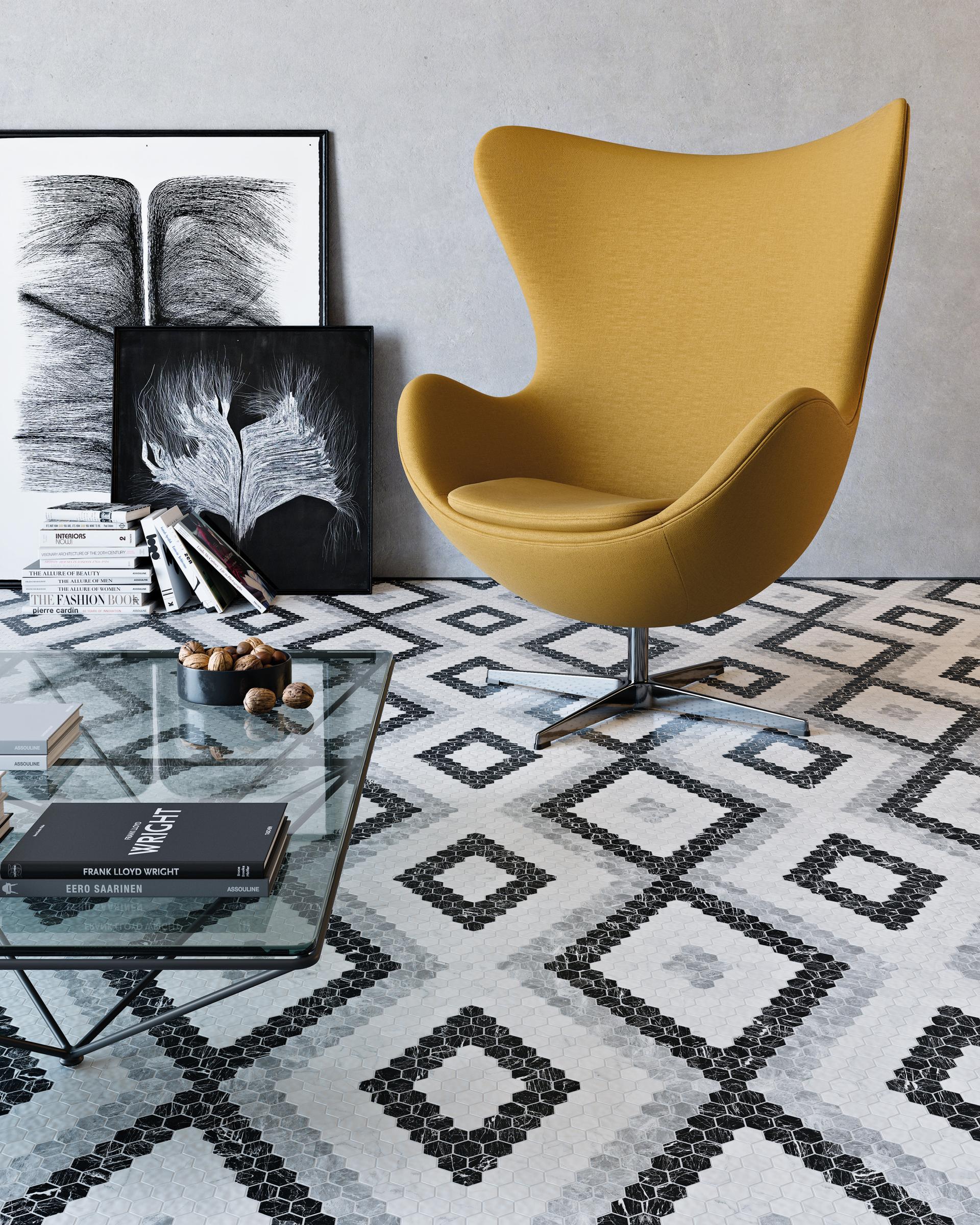 Stylish interior featuring a yellow chair, artistic decor, and geometric tile flooring from Tile of Spain.