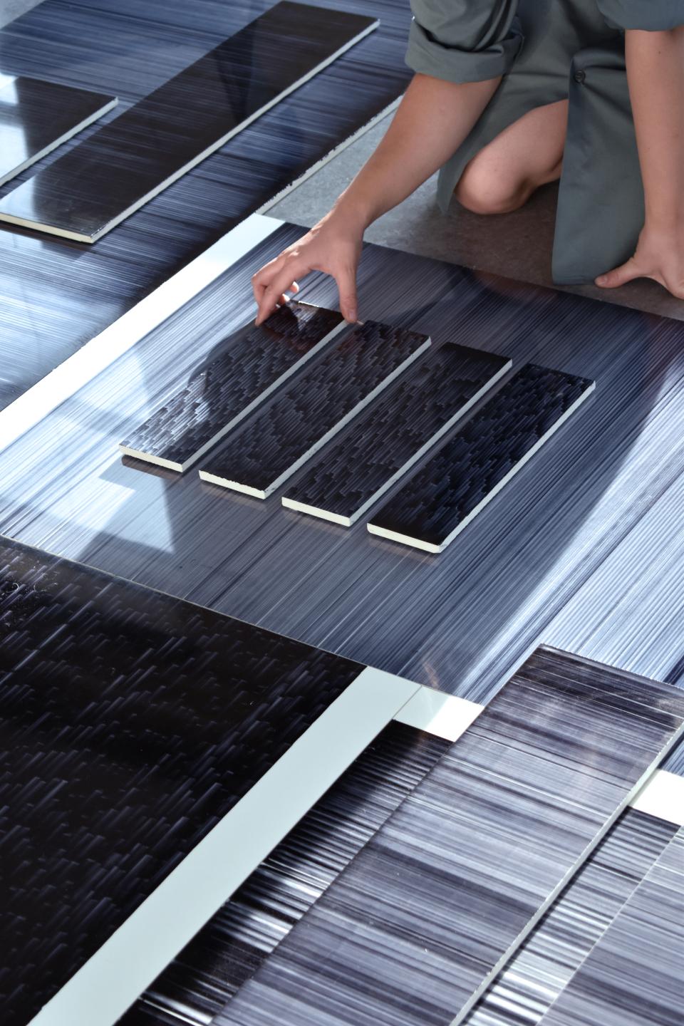 Léa Mazy showcases innovative tile designs with a focus on texture and modern printing techniques in this creative workspace.