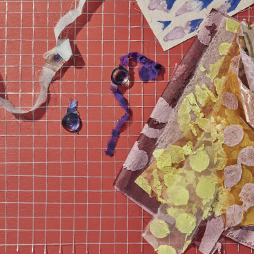 Textiles and colorful materials arranged creatively on a grid, showcasing contemporary design trends for Heimtextil 21/22.