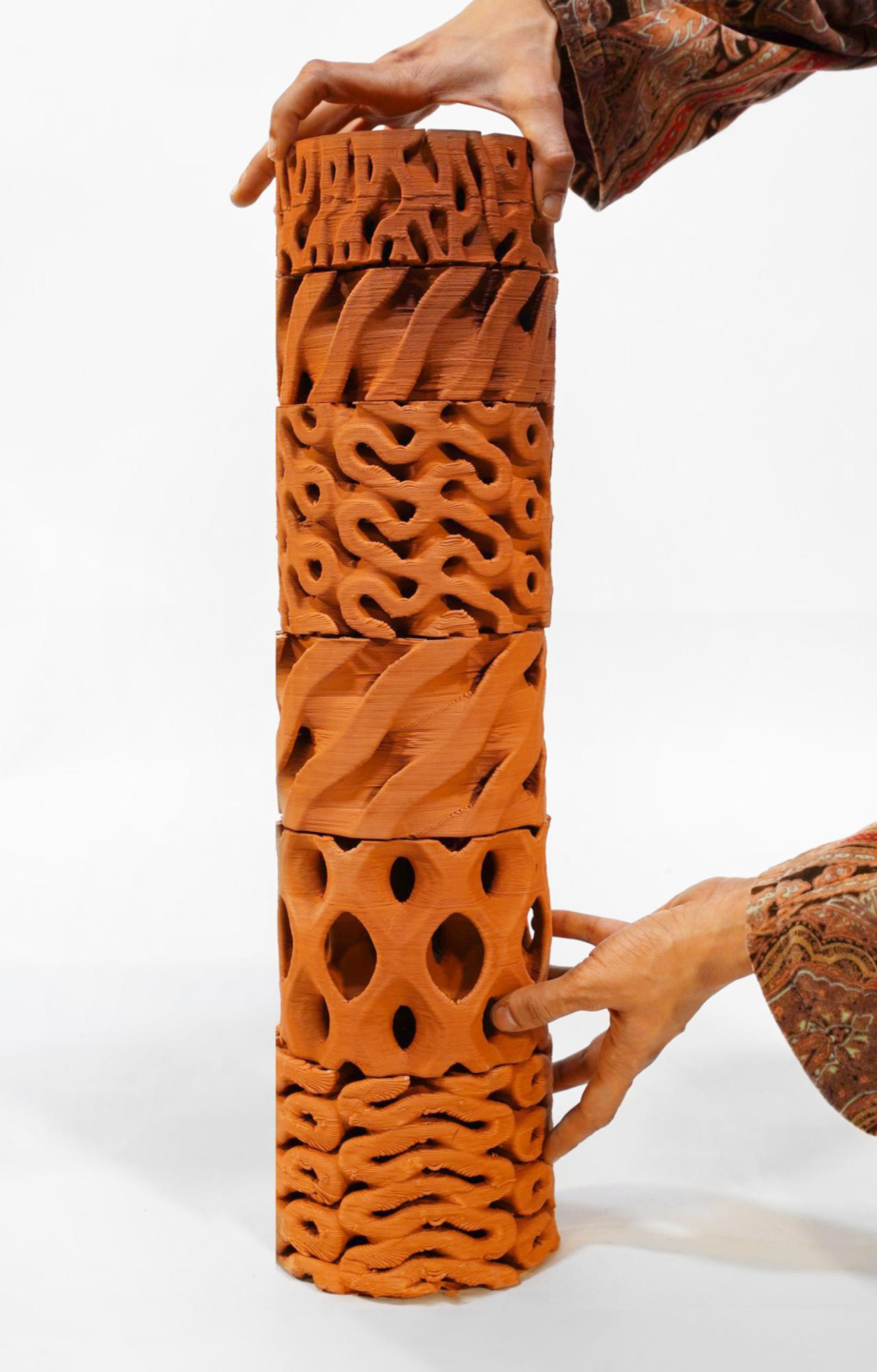 Stacked biomaterial blocks with intricate textures, showcasing sustainable design in innovative low carbon products for 2025.