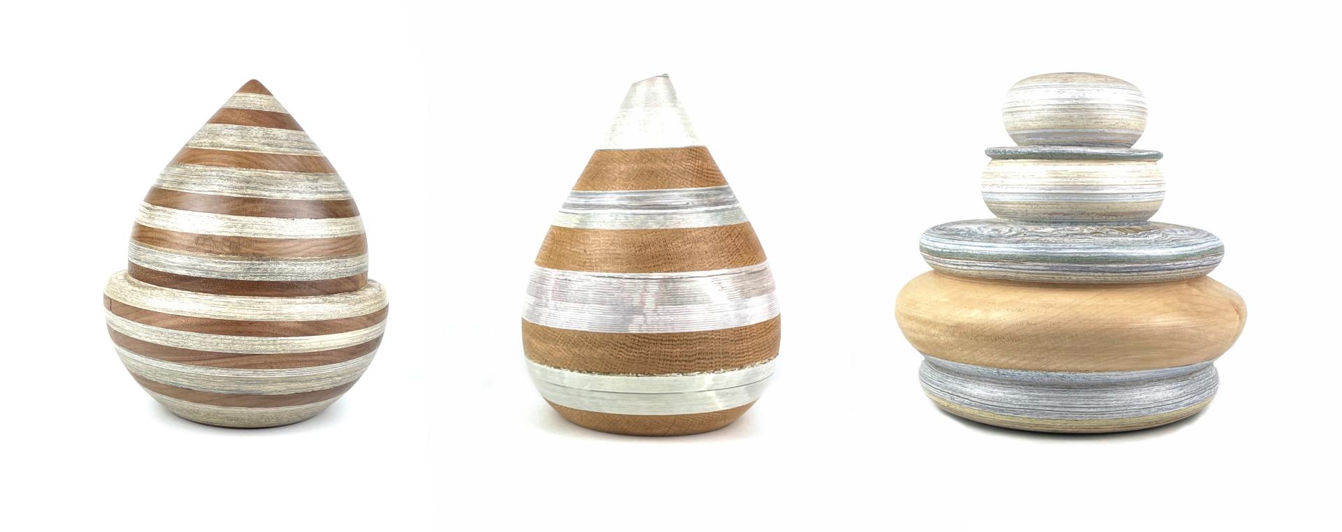 Elegant handcrafted wooden sculptures featuring striking striped designs showcased at London Craft Week 2024.
