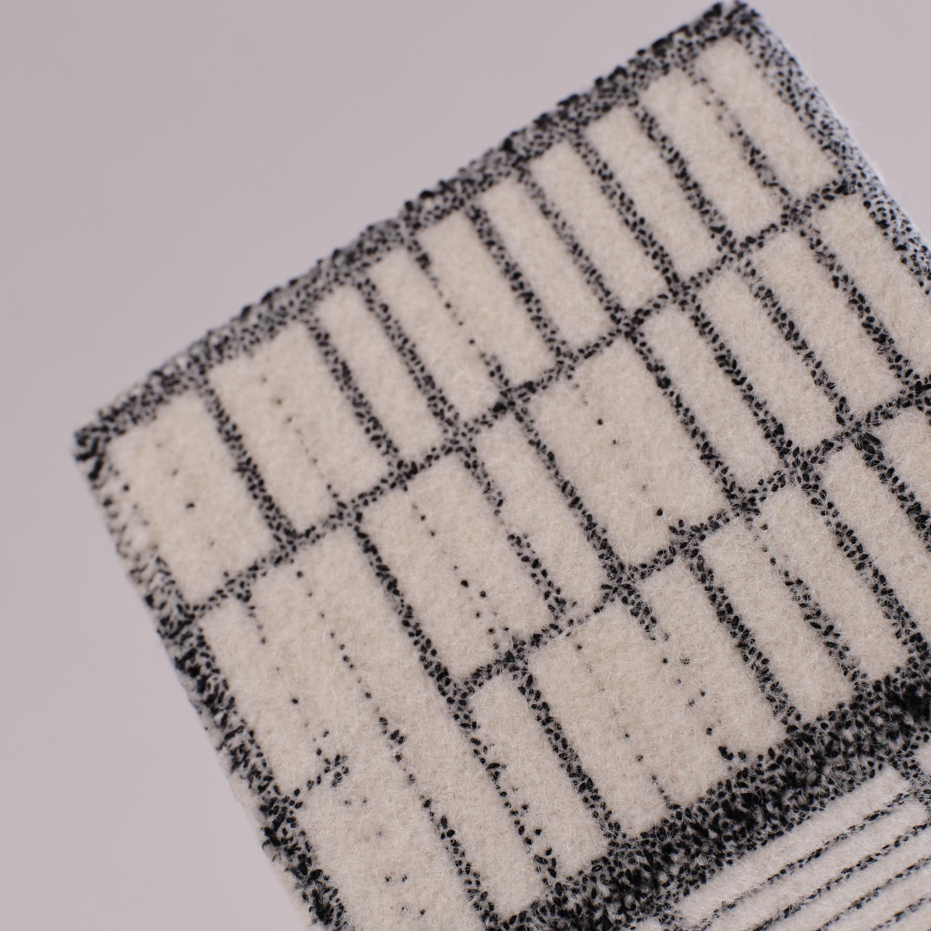 Textured textile sample showcasing intricate patterns, highlighting innovative designs from London Craft Week 2024.