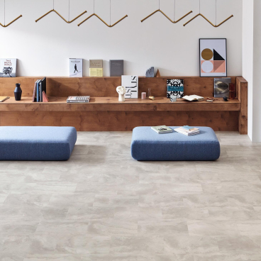 Stylish interior featuring Amtico Bio lower carbon flooring, minimalist furniture, and contemporary decor for sustainable design.