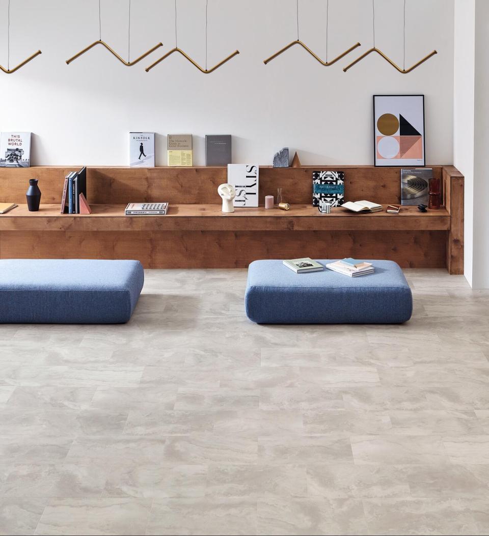 Stylish interior featuring Amtico Bio lower carbon flooring, minimalist furniture, and contemporary decor for sustainable design.