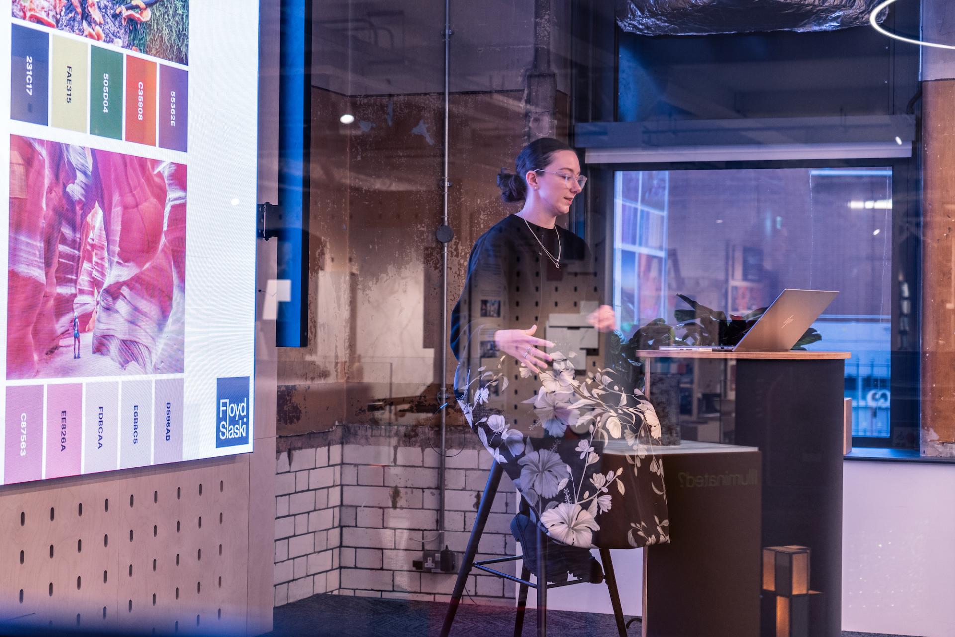 Stephanie Kyle, senior architect, discusses inclusive design strategies for neurodiversity at a presentation with visual materials.