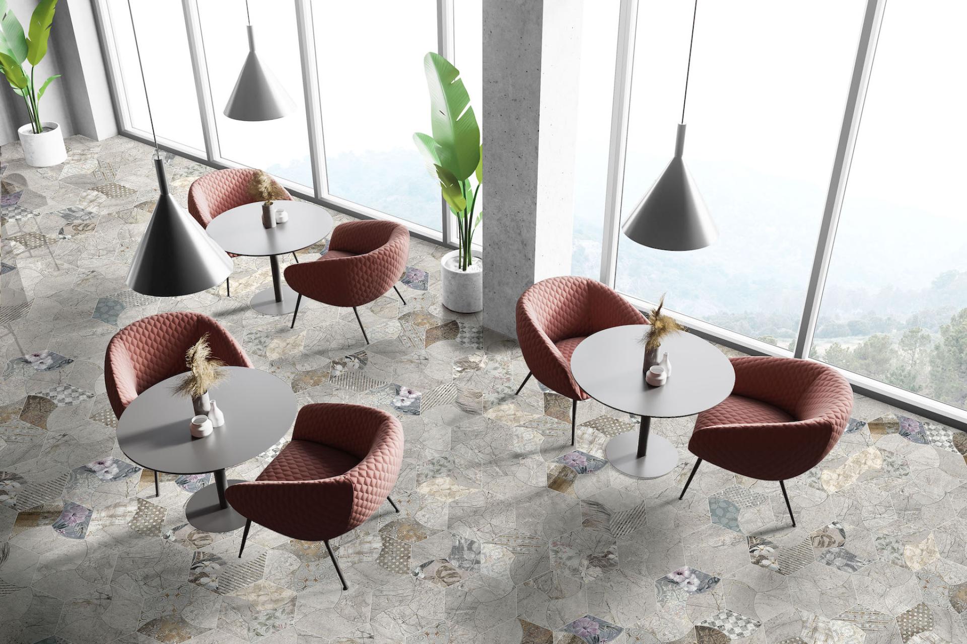 Modern interior featuring textured red chairs, sleek tables, and a stylish tile floor design from Tile of Spain.