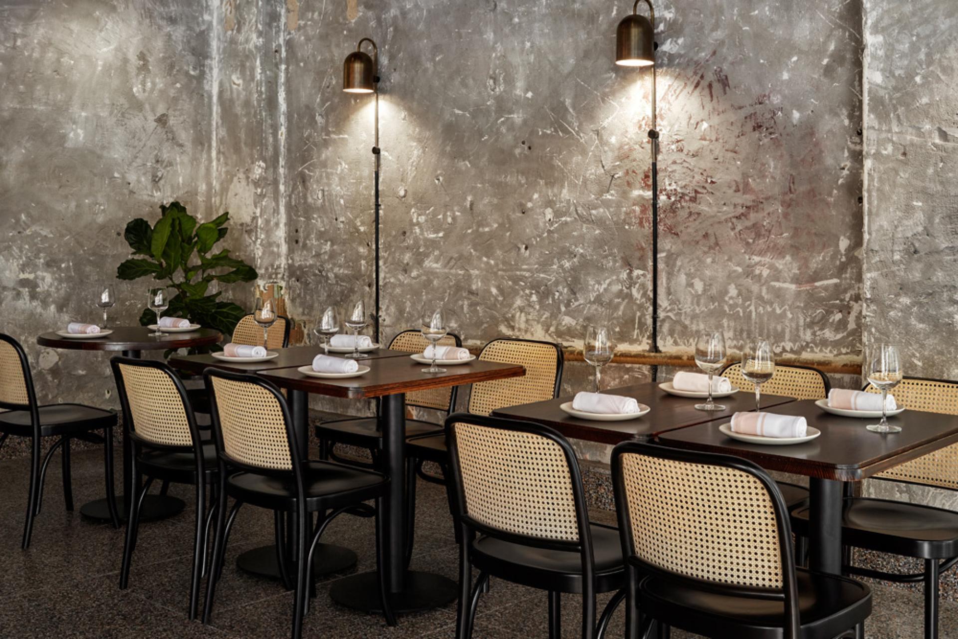 Modern Italian restaurant interior featuring rustic decor, tables set for dining, and mood lighting, capturing the essence of pasta bars.