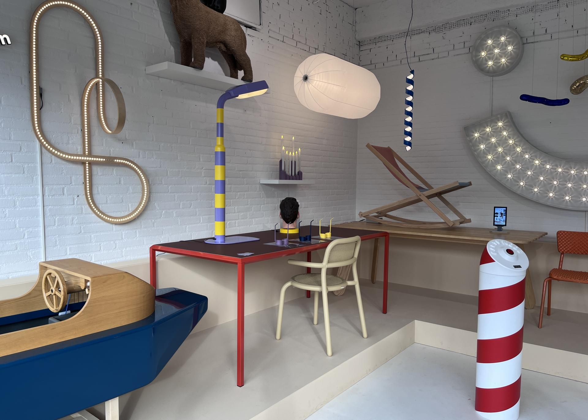 Colorful ceramics and playful design elements in a modern interior at Dutch Design Week 2023, showcasing vibrant artistry.